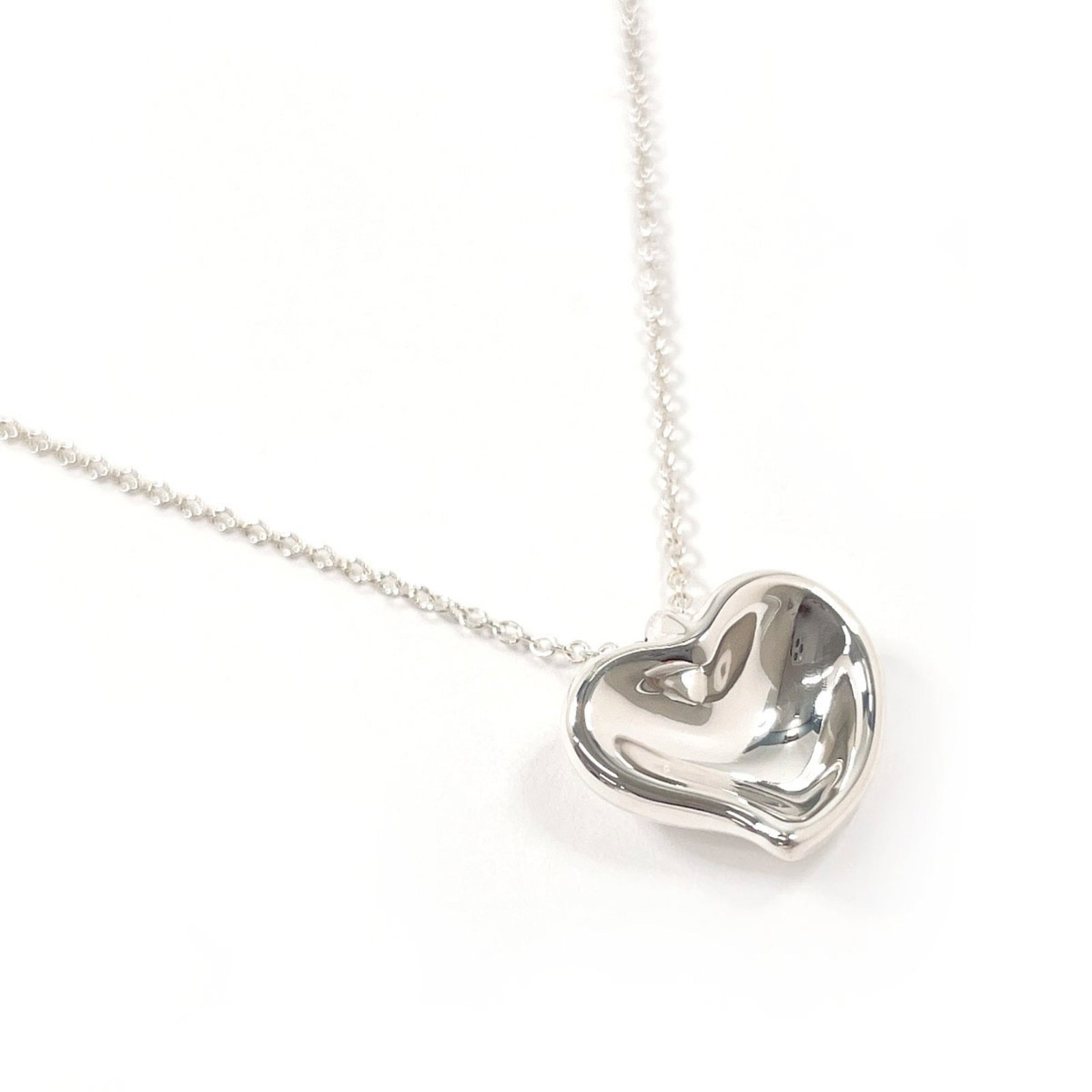 Tiffany & Co Sterling Silver 925 Elsa Peretti Necklace Curved Heart Women's Tiffany Curved Heart: Tiffany & Co Sterling Silver 925 Elsa Peretti Necklace Curved Heart Women's Tiffany Curved Heart Sterling silver necklace with a curved heart pendant, designed by Elsa Peretti for Tiffany & Co. The ne