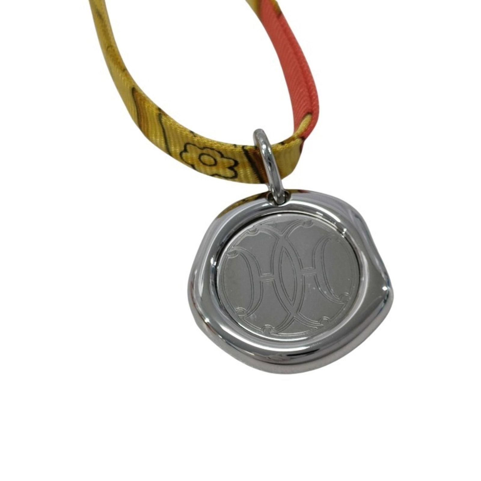 Hermes Tourbillon Necklace In Silver And Multicolor Metal With Silk Cord For Women: Hermes Tourbillon Necklace In Silver And Multicolor Metal With Silk Cord For Women Silver and multicolor metal Hermes Tourbillon Necklace features a sleek pendant design, perfectly complemented by a