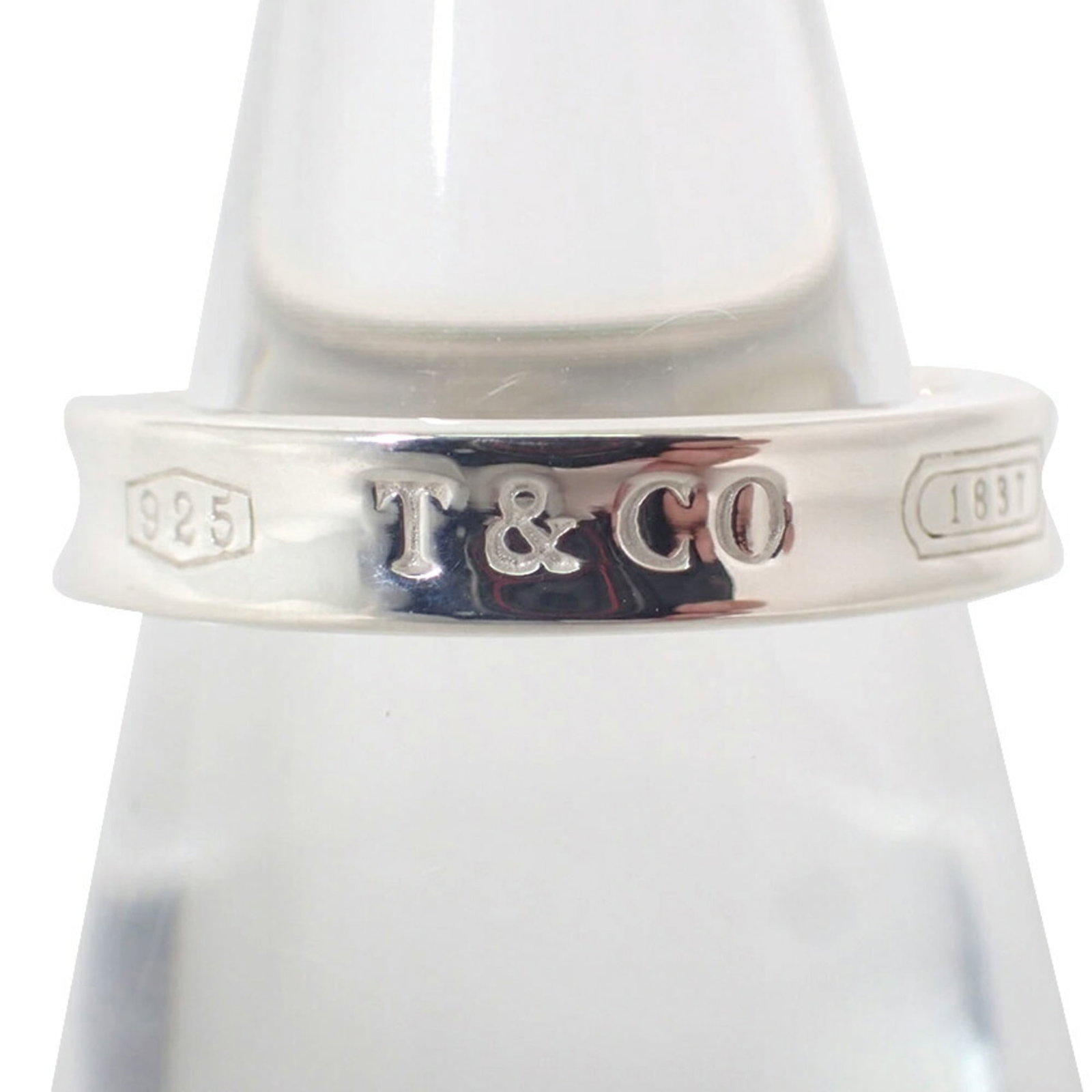 Sterling Silver Ring Tiffany Band: Sterling Silver Ring Tiffany Band Sterling silver Tiffany band ring in excellent condition, with hardly any signs of wear. This beautiful piece features the iconic Tiffany brand and is made from high-