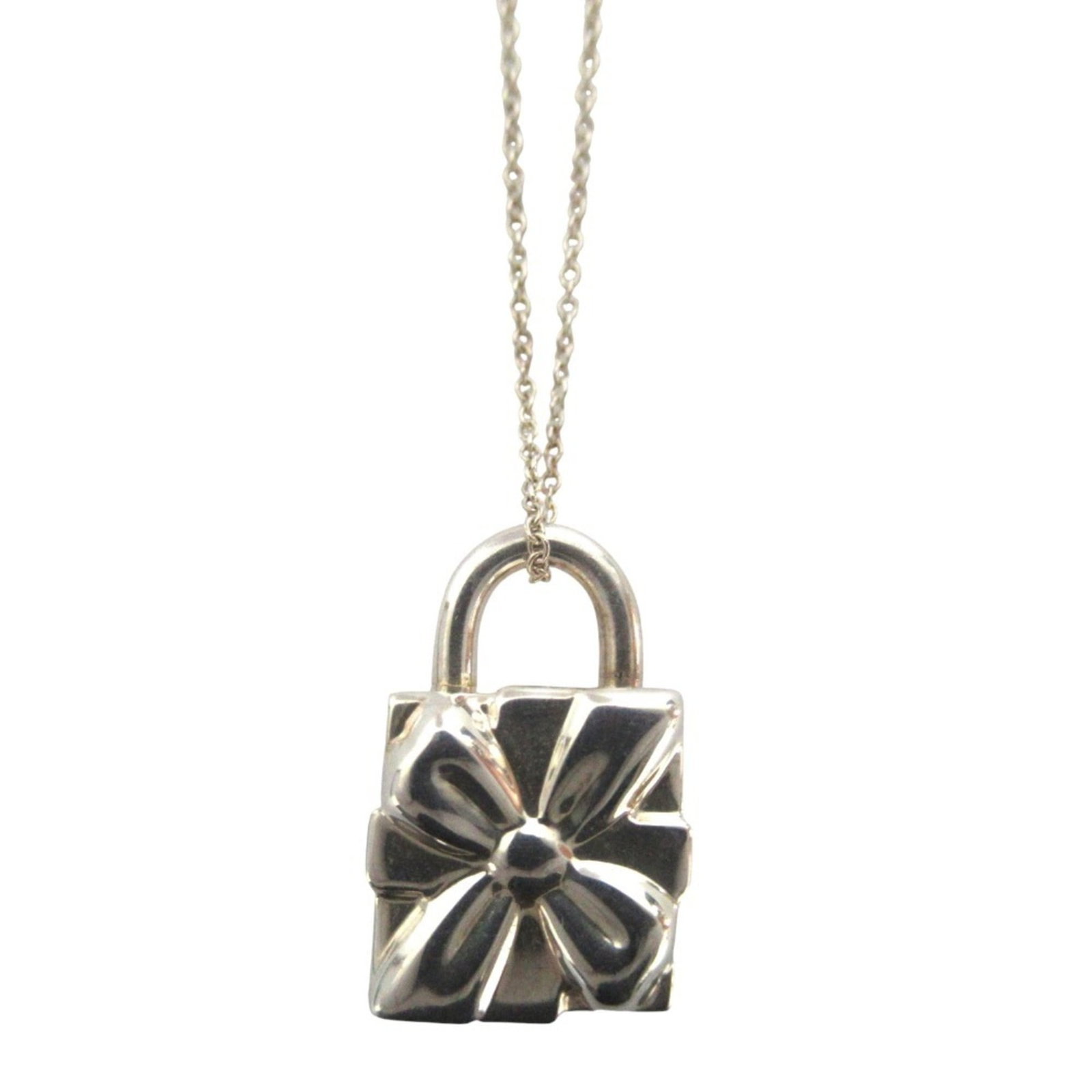 Tiffany Co Gift Box Motif 925 Silver Women's Necklace Pendant: Tiffany Co Gift Box Motif 925 Silver Women's Necklace Pendant The Tiffany Co Gift Box Motif 925 Silver Women's Necklace Pendant boasts a classic design with intricate details, featuring a silver penda