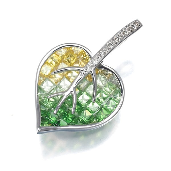 Yellow & Green Sapphire Diamond Leaf Pendant 18K 750 White Gold: Yellow & Green Sapphire Diamond Leaf Pendant 18K 750 White Gold Yellow and green sapphires are set in an elegant 18k white gold diamond leaf pendant, creating a striking contrast between the natural g
