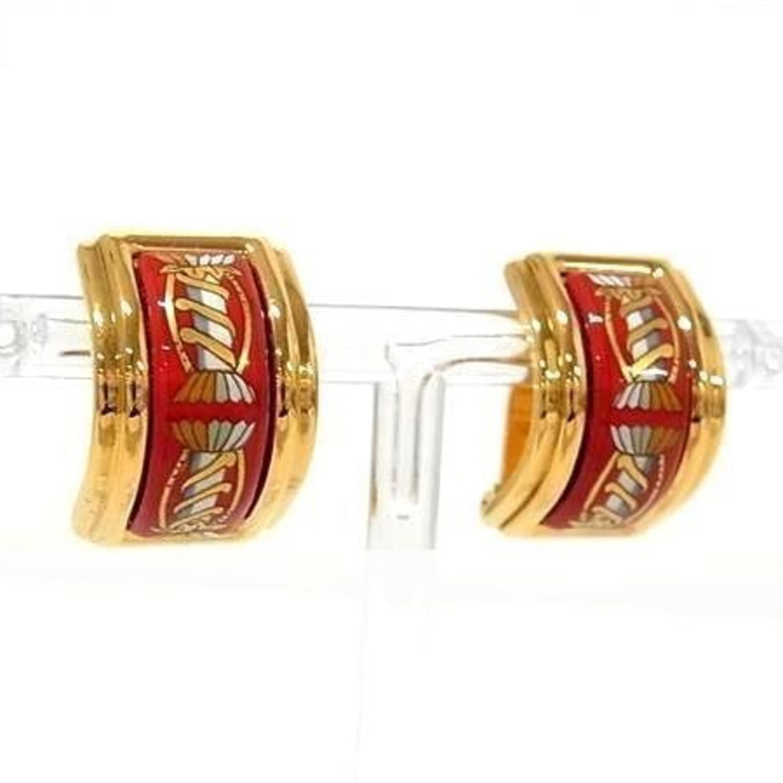 Hermes Clip Earrings Cloisonn/ Enamel Metal: Hermes Clip Earrings Cloisonn/ Enamel Metal Gold and red Cloisonn/Enamel metal clip earrings from Hermes, featuring a subtle design with some traces of usage visible. The earrings have a few minor scr