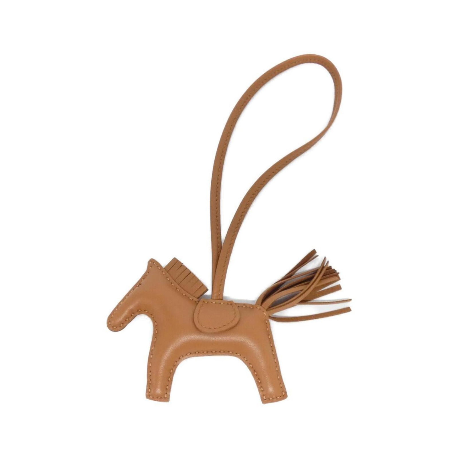 Hermes Handbag Charm Agneau Milo: Hermes Handbag Charm Agneau Milo Agneau Milo Handbag Charm from Hermes features a rich brown color and a unique design. Made from Agneau Milo material, it boasts a distinctive look that sets it