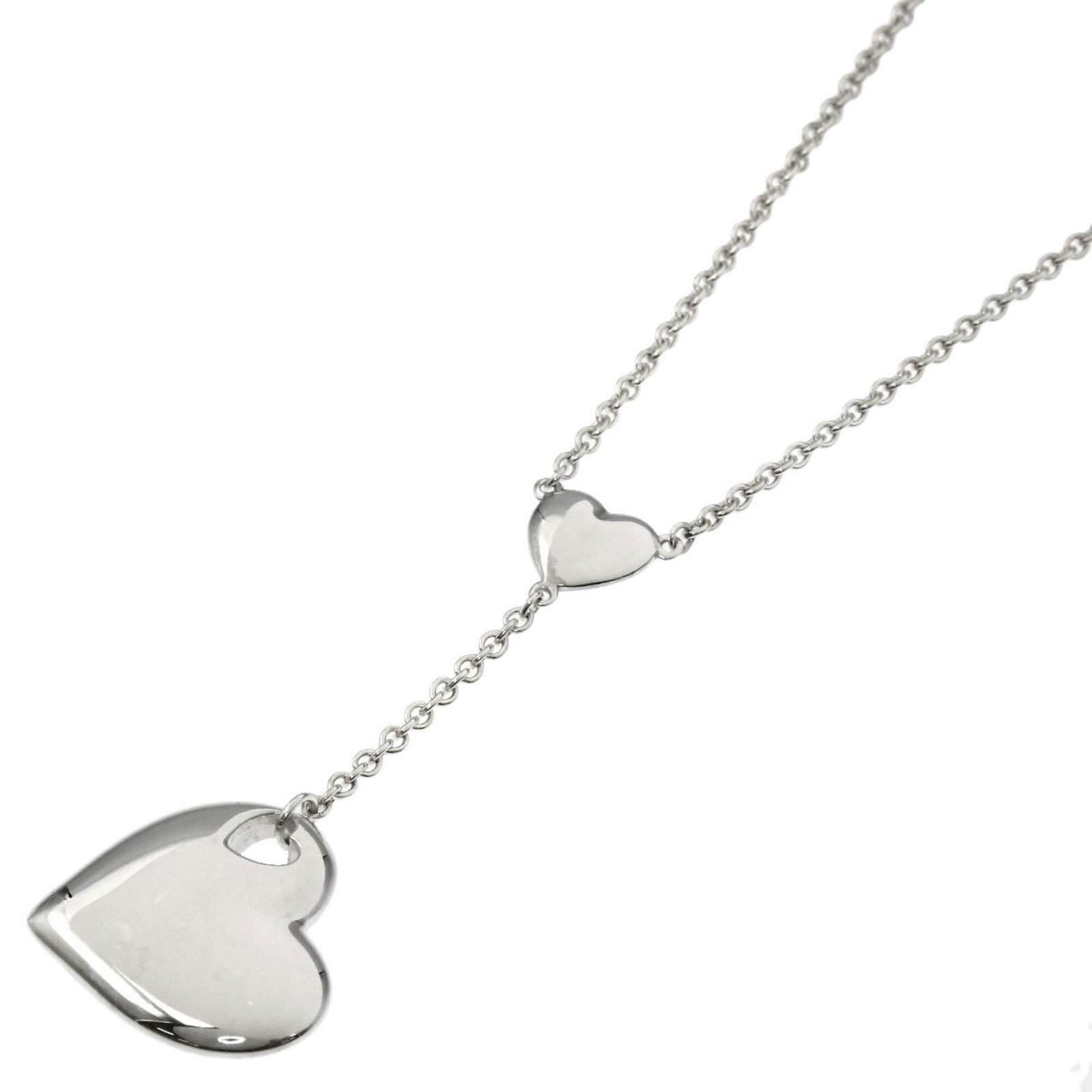 Women's heart motif necklace silver by Tiffany Co.: Women's heart motif necklace silver by Tiffany Co. Silver heart motif necklace by Tiffany Co. features a classic design with intricate details, showcasing the iconic brand's signature style. The
