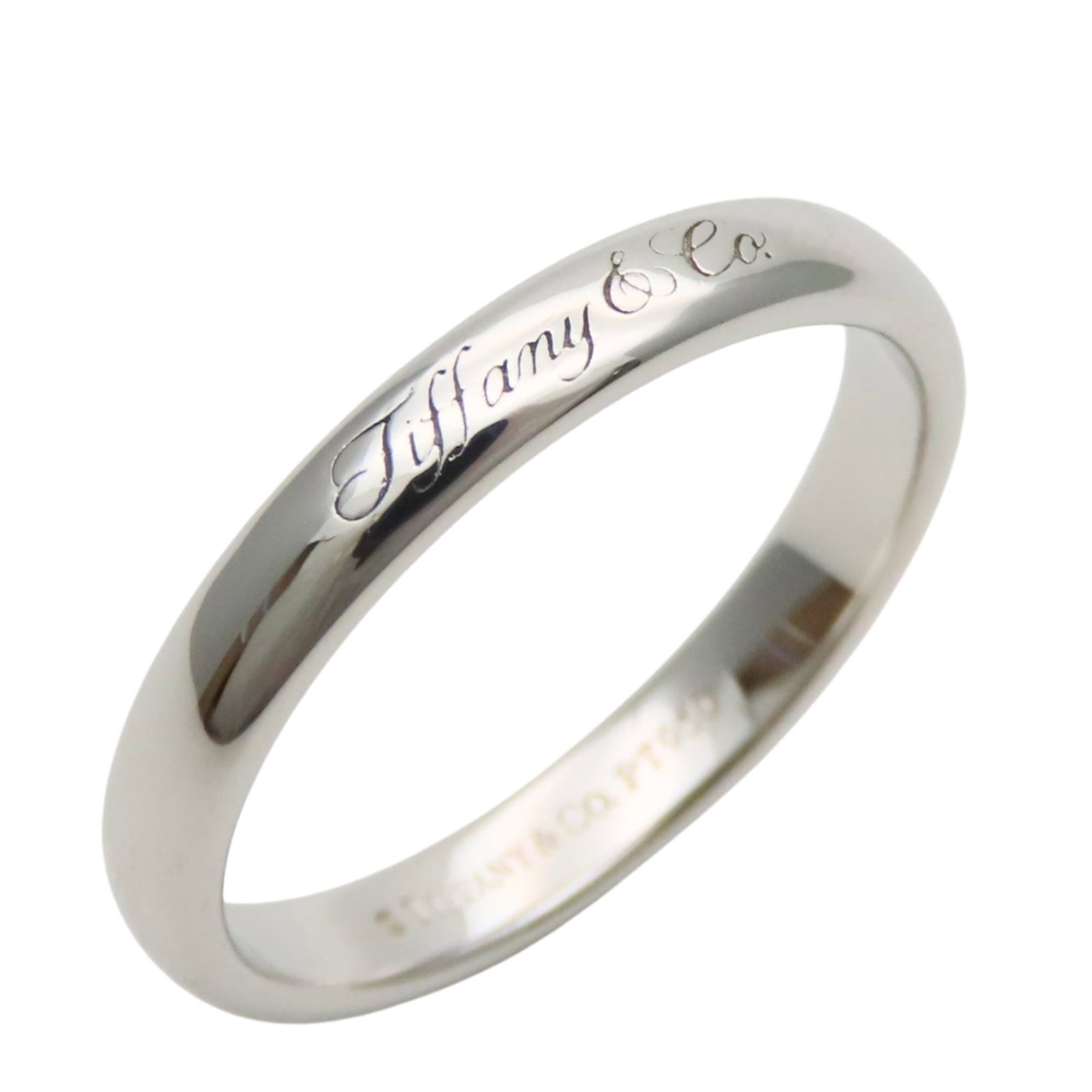Platinum ring by Tiffany band: Platinum ring by Tiffany band Platinum ring by Tiffany & Co. features a band design in platinum, available in US size 7, and bears a signature. This item is in mint condition, like new, with no signs