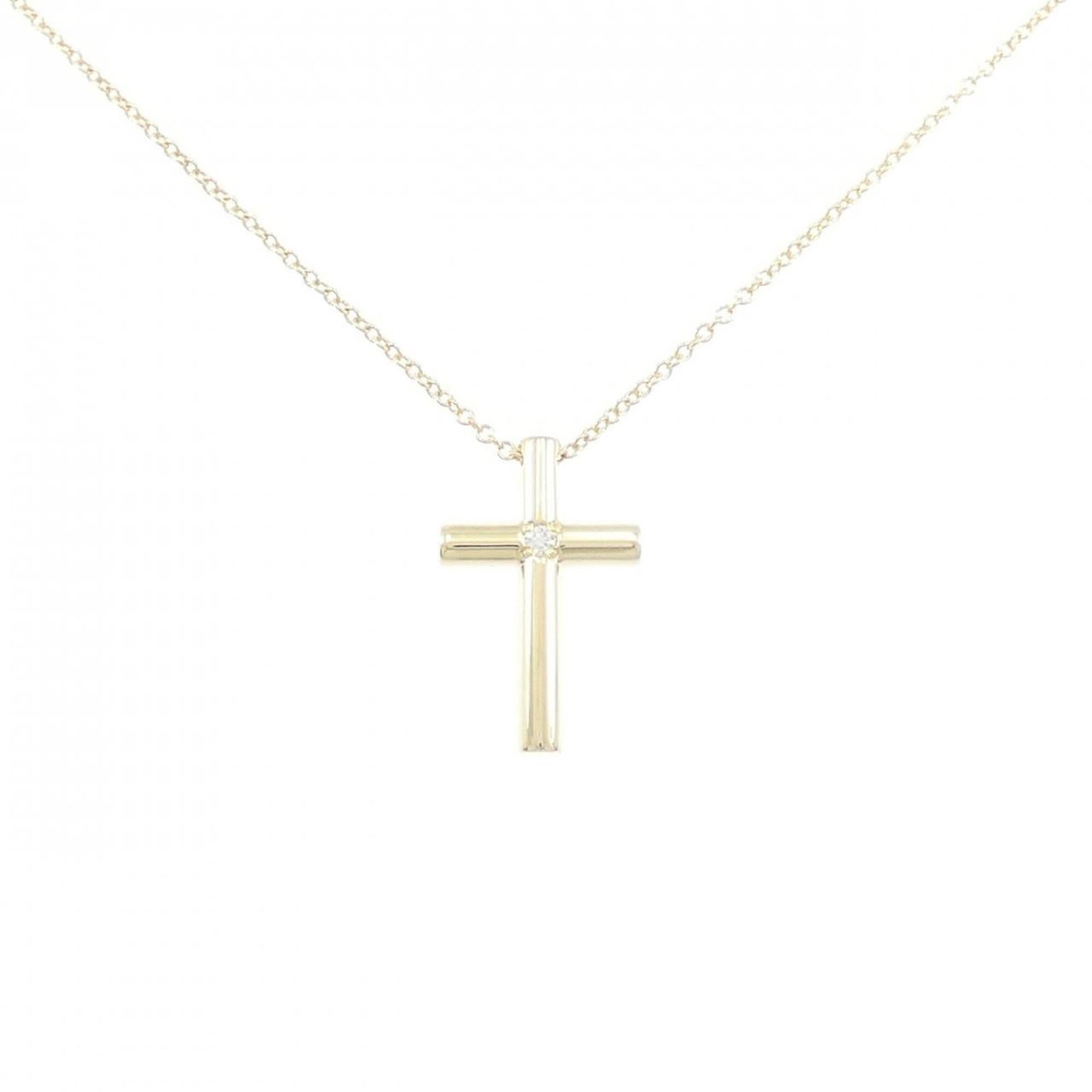 Cross Necklace by Tiffany: Cross Necklace by Tiffany Yellow gold (18K) Tiffany necklace featuring a diamond pendant, crafted with a classic cross design. The necklace boasts a 41 cm circumference and measures 17.8mm x 11.4mm