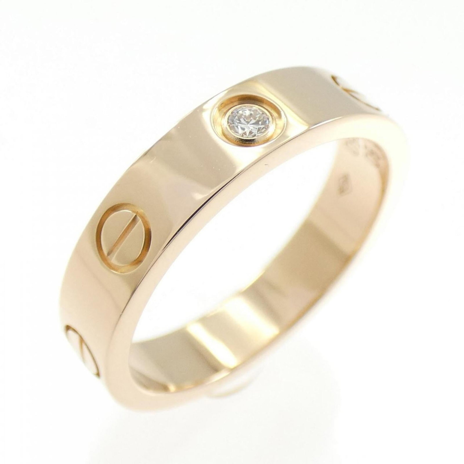 Pink gold 18k ring band from Cartier: Pink gold 18k ring band from Cartier Pink gold 18k ring band from Cartier, featuring a classic design with subtle elegance. This 50mm band measures US size 5.5 and boasts a refined pink gold finish.
