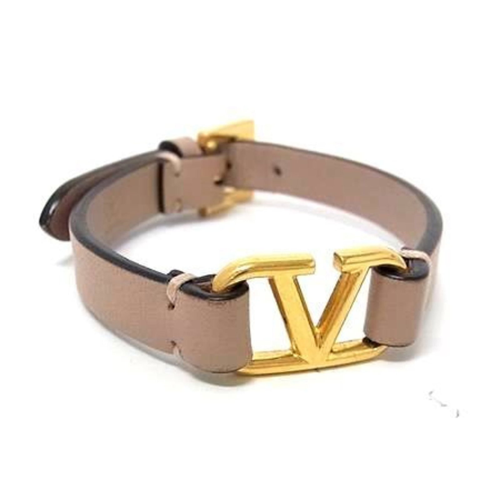 Valentino Charm Bracelet Leather: Valentino Charm Bracelet Leather Used Valentino Charm Bracelet Leather in beige, with a 9mm width and total length of 23cm. The bracelet bears some traces of usage and minor scratches/dirt, but