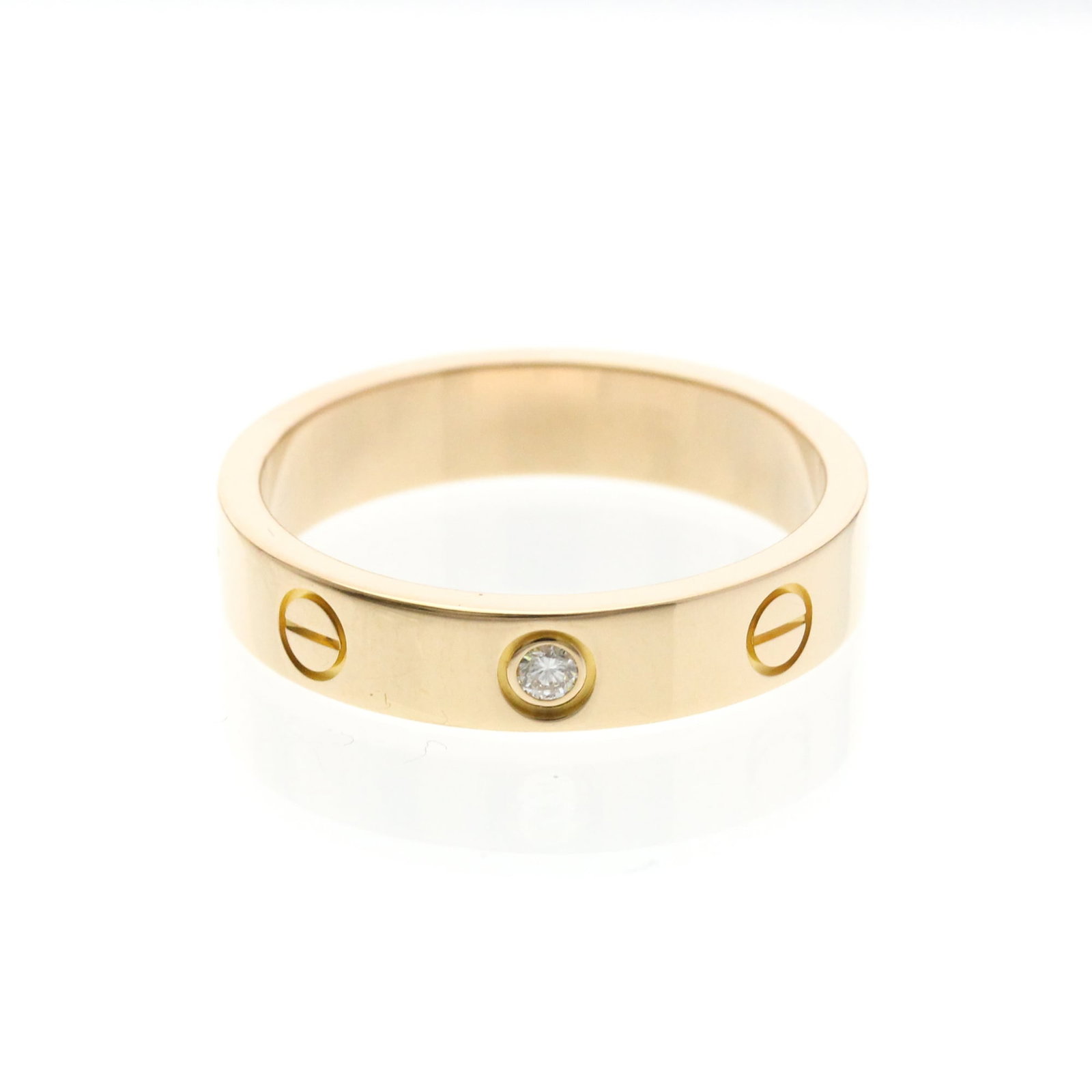 Pink gold 18k ring band from Cartier: Pink gold 18k ring band from Cartier Pink gold 18k ring band from Cartier, featuring a classic fashion design with subtle pink hue. This elegant piece boasts a diamond stone and measures 53 in brand