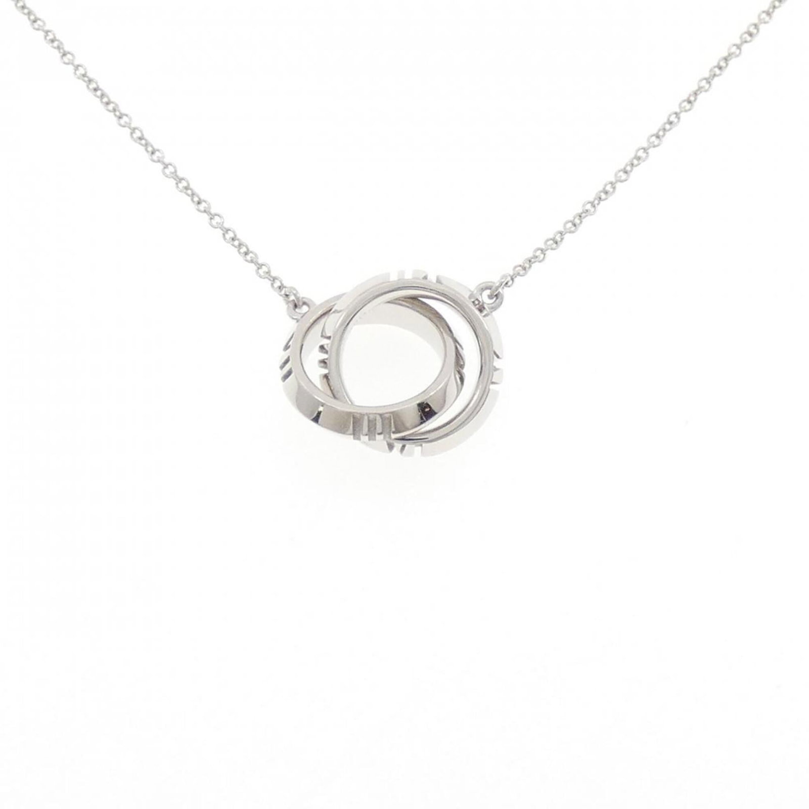 Tiffany & Co. Closed Interlocking Necklace: Tiffany & Co. Closed Interlocking Necklace Tiffany & Co. Closed Interlocking Necklace in White Gold, featuring a 12.6mm x 12.6mm pendant with a 40 cm - 45 cm adjustable neck circumference. This used (