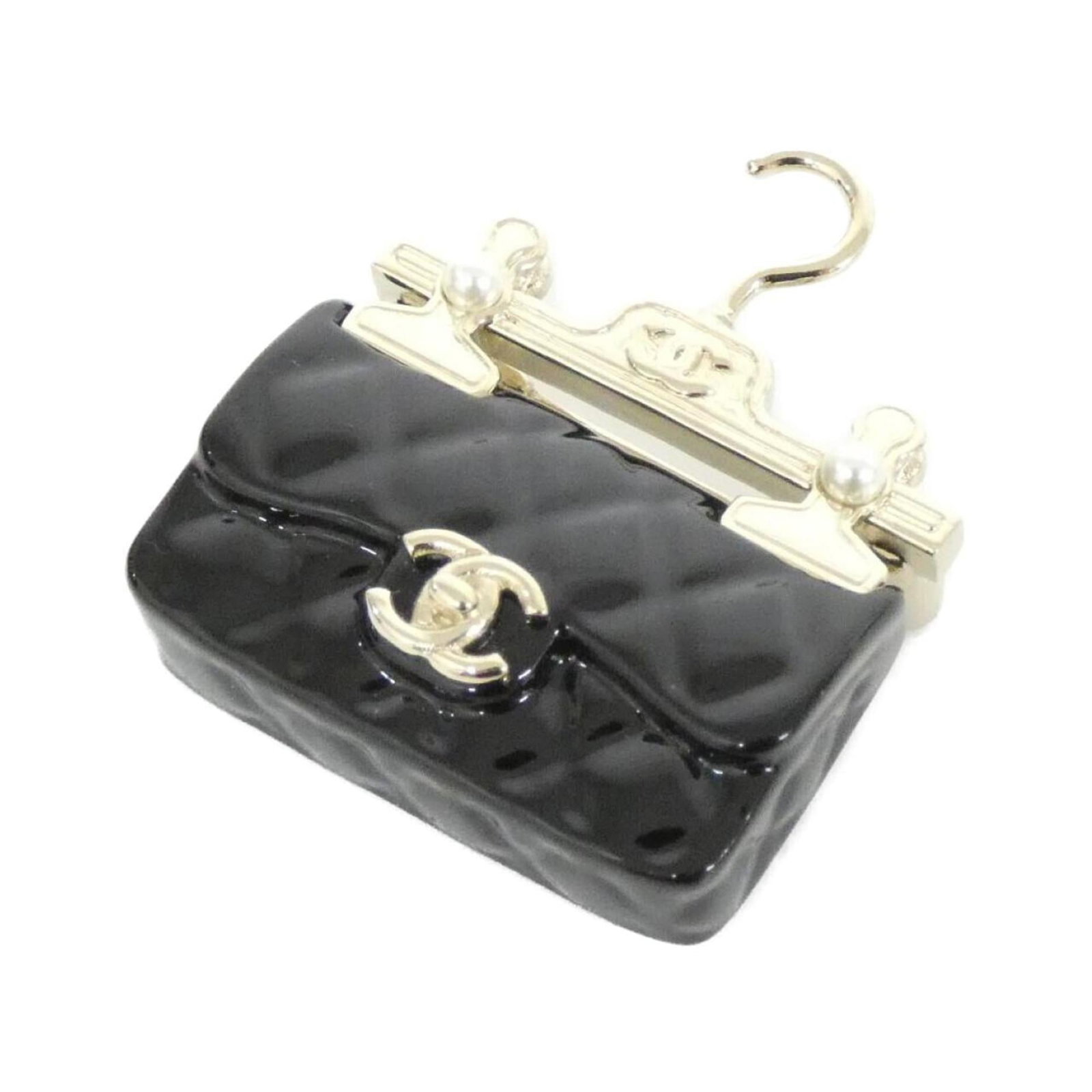 Artificial Pearl by Chanel: Artificial Pearl by Chanel Artificial Pearl by Chanel, a sleek and sophisticated brooch featuring high-quality artificial pearl details in black and white hues. Measuring 4cm x 3cm, this elegant