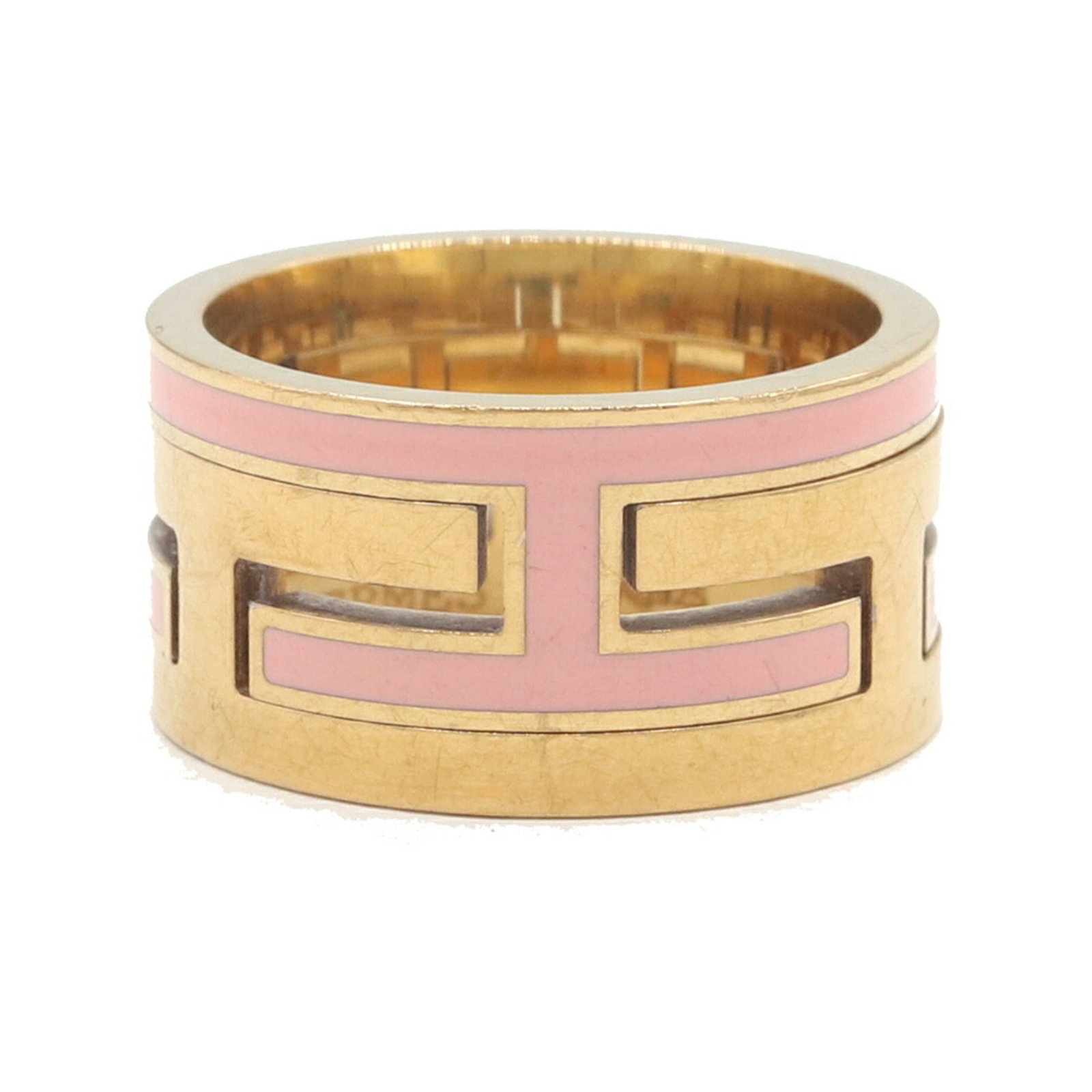 Sterling silver ring band Hermes: Sterling silver ring band Hermes Sterling silver ring band from Hermes, featuring a gold and pink design. The band bears traces of usage with minor scratches and dirt, but remains in good condition