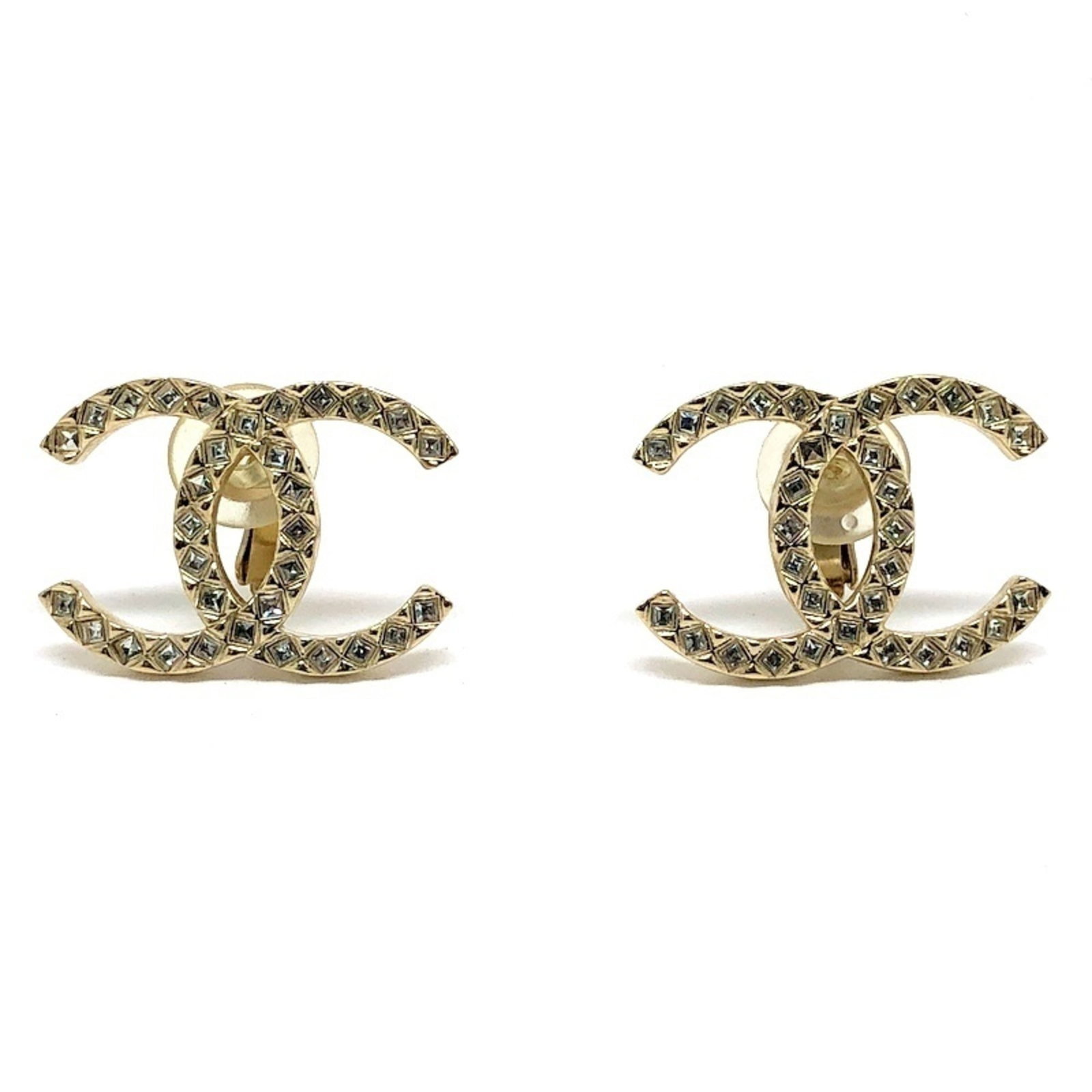 Rhinestone Clip Earrings By Chanel: Rhinestone Clip Earrings By Chanel Rhinestone clip earrings by Chanel feature rhinestones as the primary decorative element. The earrings measure 20.00mm x 28.00mm and are made from a combination of m