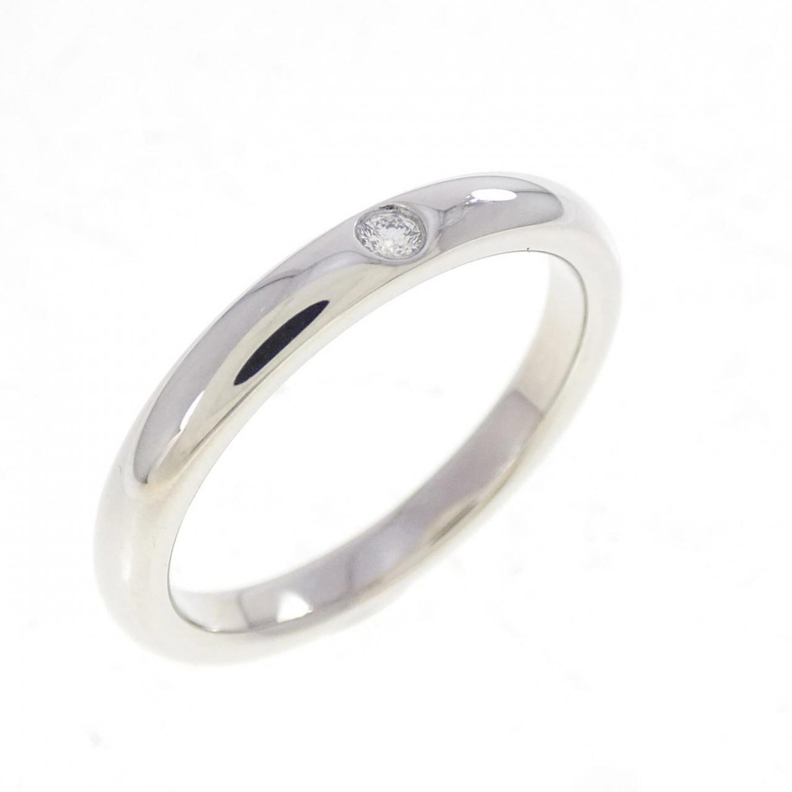 Platinum ring by Tiffany band: Platinum ring by Tiffany band Platinum ring by Tiffany features a diamond stone set in a high-quality band, crafted from 950 platinum. The ring bears a few traces of usage and minor scratches, but rem