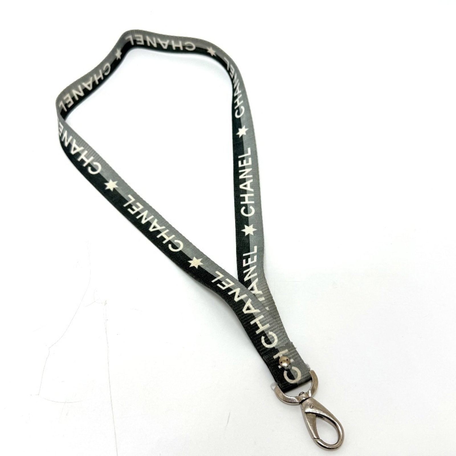 Chanel logo neck strap holder for women gray canvas necklace small items miscellaneous goods: Chanel logo neck strap holder for women gray canvas necklace small items miscellaneous goods Gray canvas necklace strap holder from Chanel, featuring the iconic logo. This small item has traces of