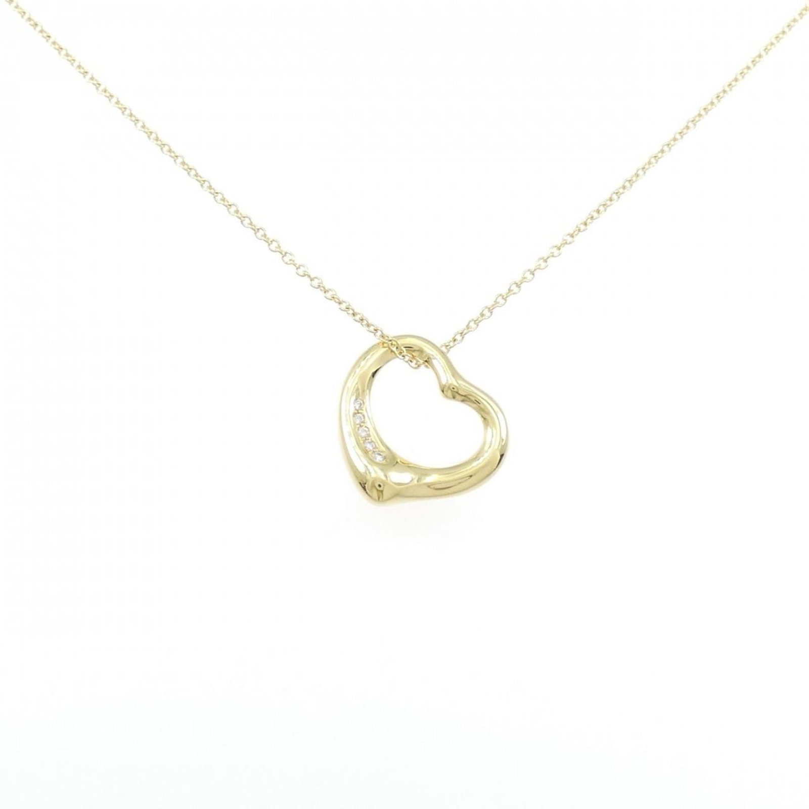 Heart Open Tiffany Necklace: Heart Open Tiffany Necklace Yellow Gold Tiffany Necklace with Pendant. This beautiful necklace features a 15.5mm x 15.5mm pendant in yellow gold, suspended from a chain that accommodates a neck