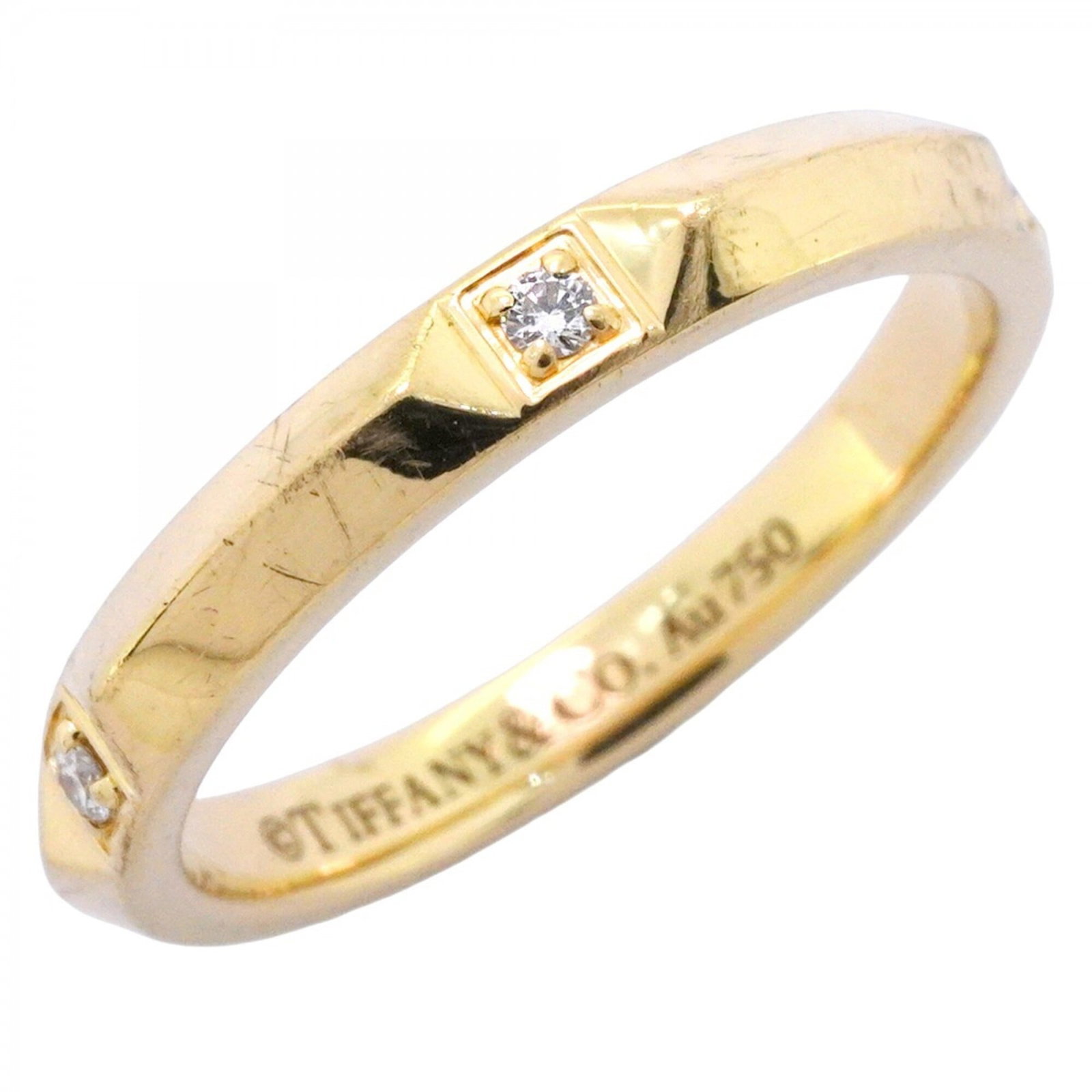 Tiffany Ring Gold Yellow 18K: Tiffany Ring Gold Yellow 18K Yellow gold band ring with a diamond stone, designed by Tiffany. The 18K yellow gold band features a subtle shine and a classic design that suits women's style. This used 