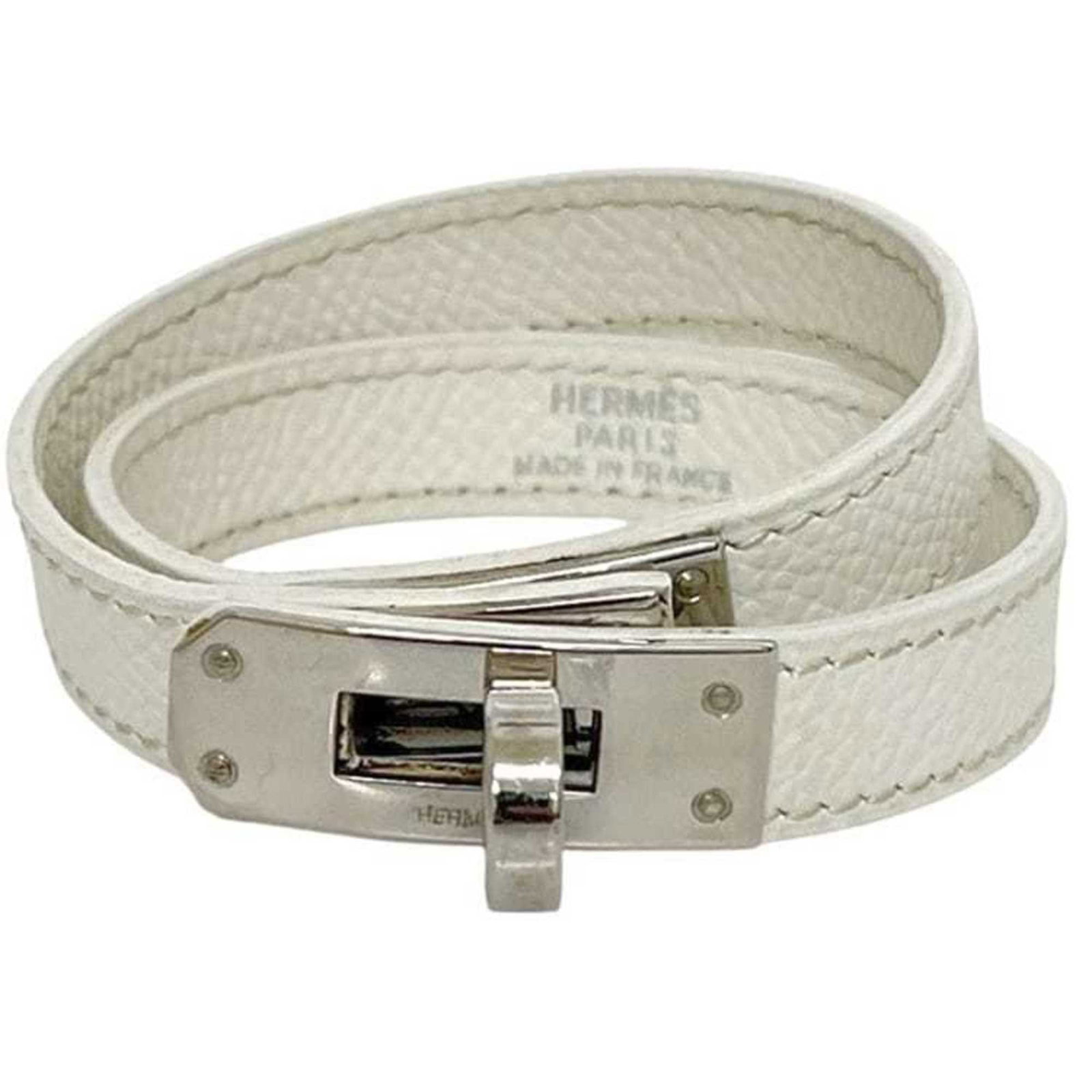 Hermes Charm Bracelet Leather: Hermes Charm Bracelet Leather The Hermes Charm Bracelet Leather boasts a sleek, silver finish and a durable leather strap, measuring 15cm in length. With its classic design and subtle scratches, this 