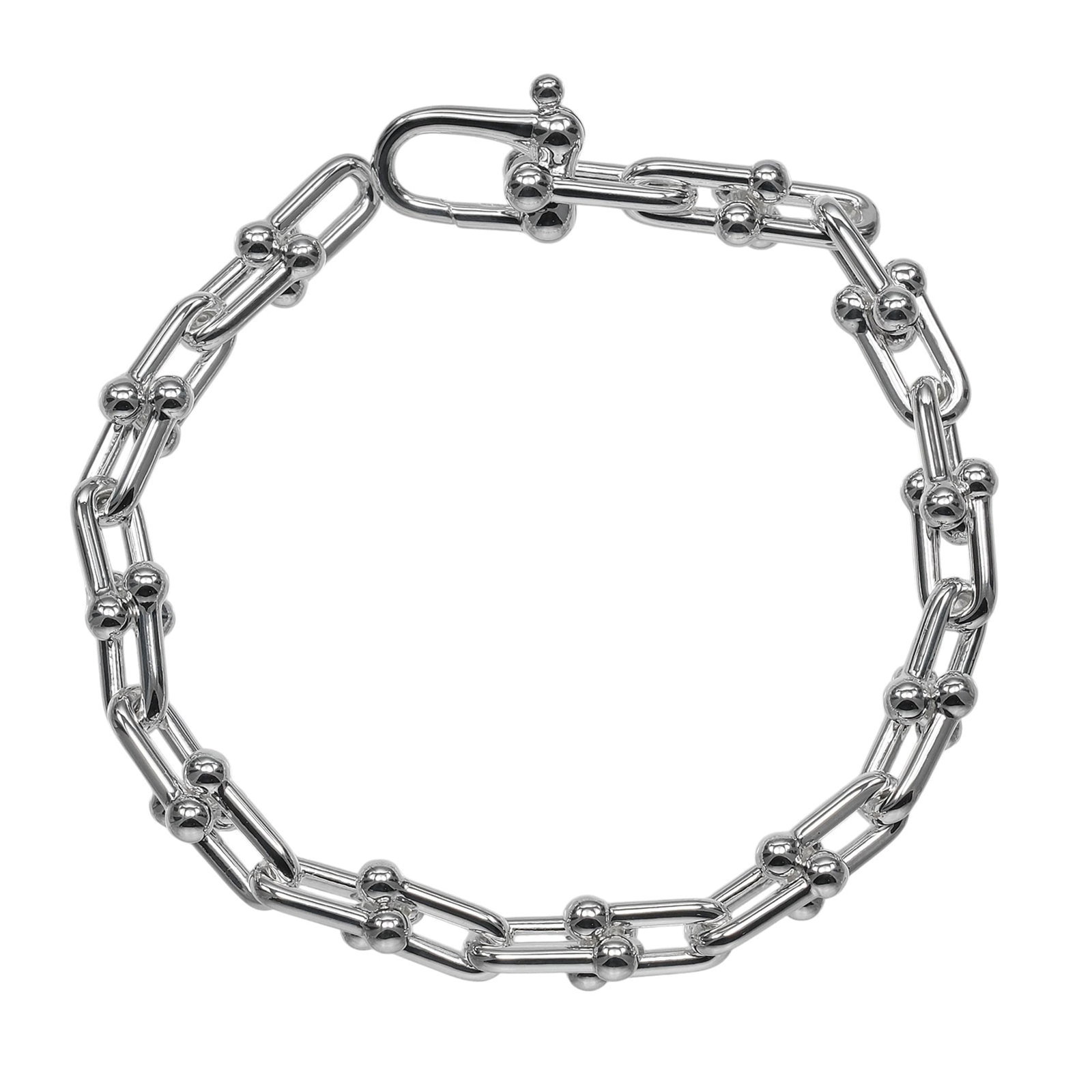 Silver Tiffany Link Bracelet: Silver Tiffany Link Bracelet Silver Tiffany Link Bracelet, made from high-quality silver (925), features a classic link design. Measuring 15.5cm in length, this elegant bracelet showcases a subtle