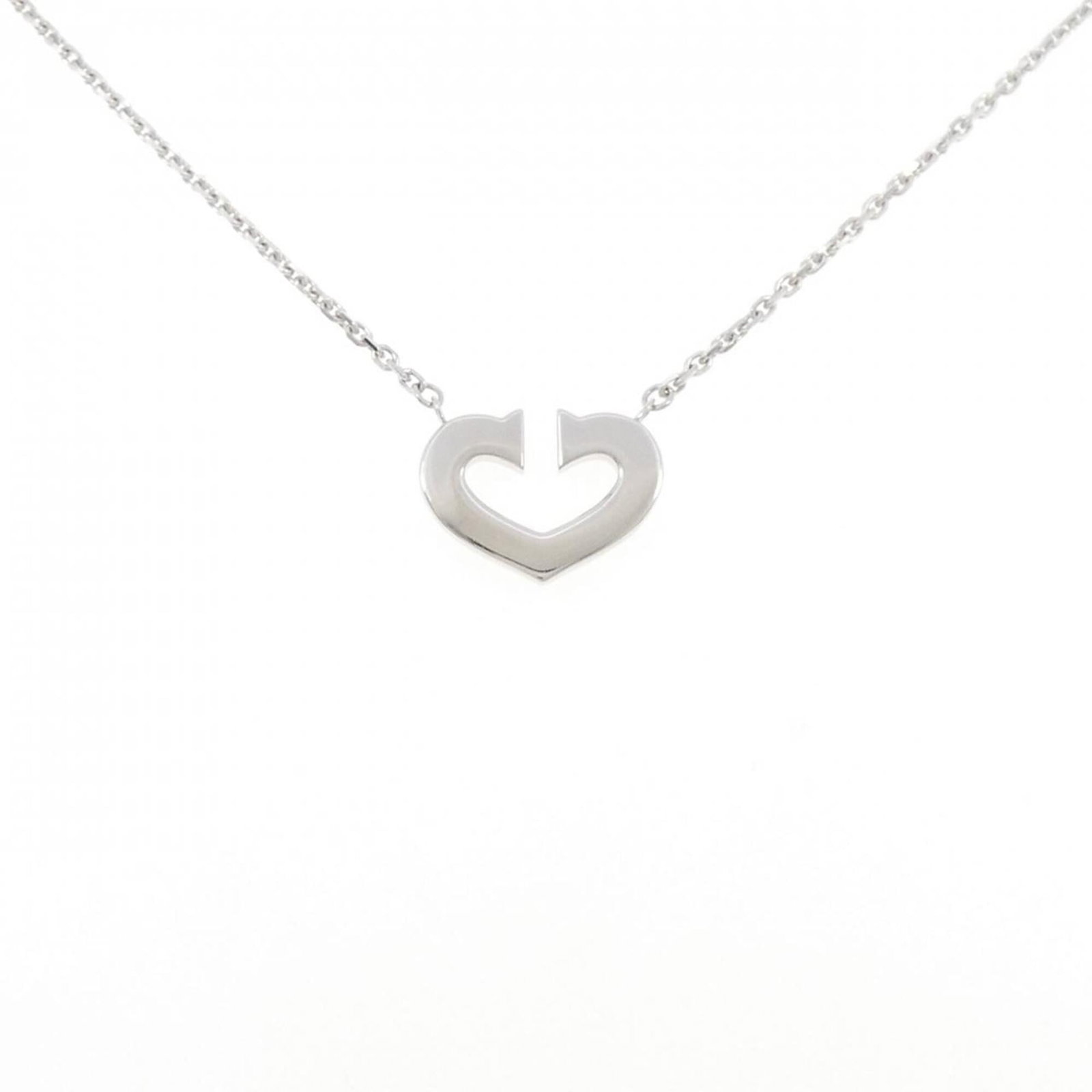 Heart Necklace from Cartier: Heart Necklace from Cartier Cartier's elegant Heart Necklace, crafted from 18K white gold, boasts a delicate pendant measuring 12.2mm x 16.6mm with intricate details. This stunning piece features a su