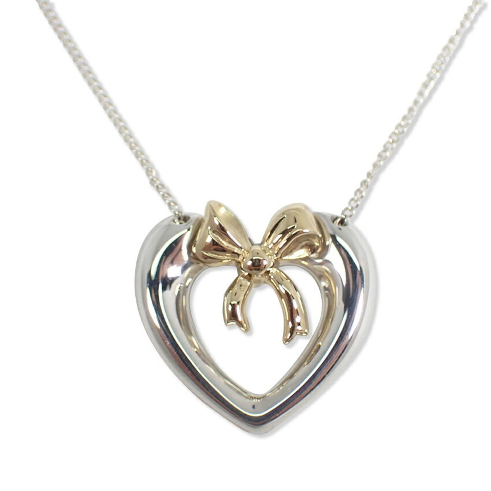 Tiffany Co 925 Heart Pendant Necklace Ribbon: Tiffany Co 925 Heart Pendant Necklace Ribbon Sterling Silver and Yellow Gold 925 Heart Pendant Necklace Ribbon, crafted with intricate details, features a beautiful heart-shaped pendant suspended