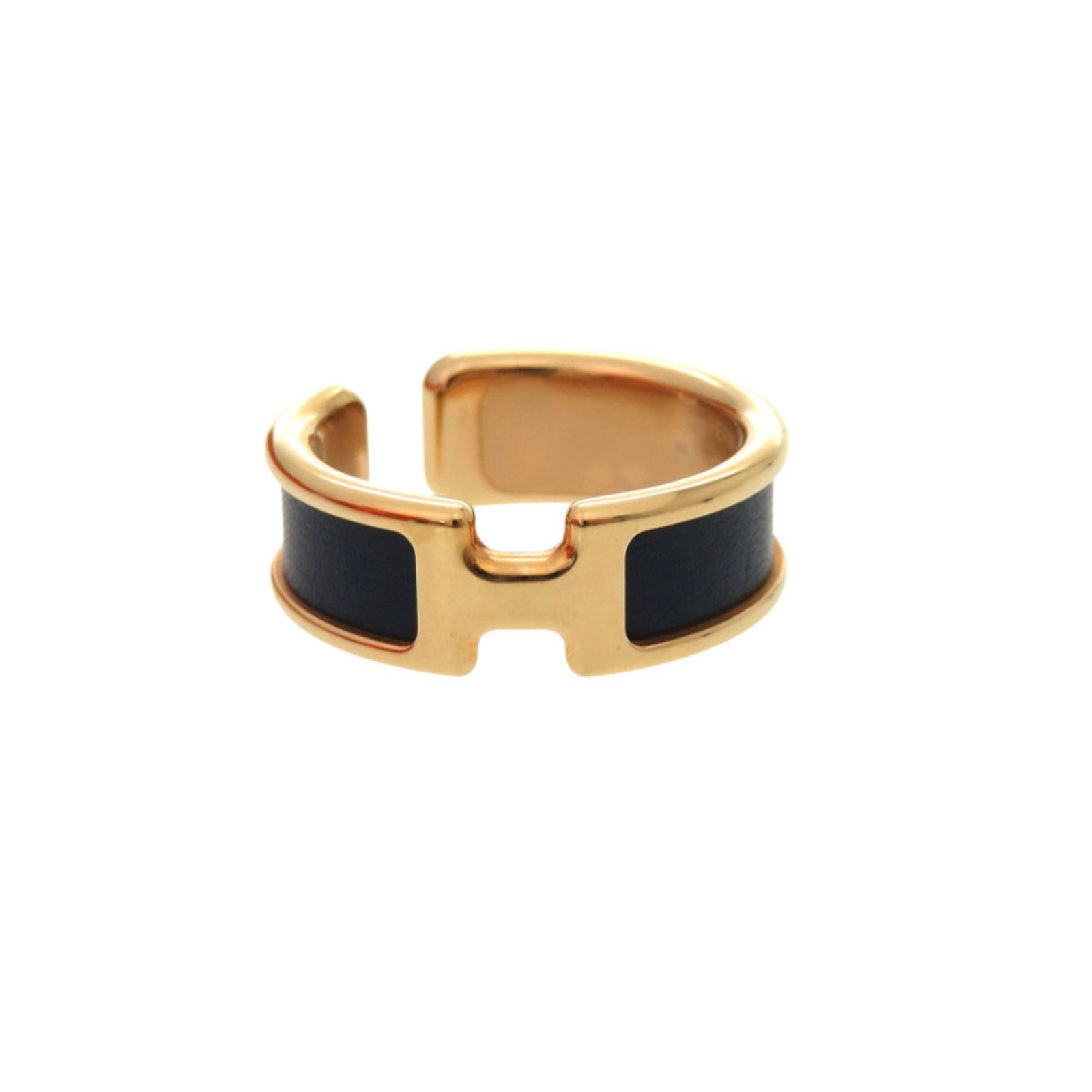Metal Leather Earcuff by Hermes: Metal Leather Earcuff by Hermes Metal Leather Earcuff by Hermes features gold and navy accents, showcasing the brand's signature blend of luxury materials. This opened earcuff boasts a sleek design th