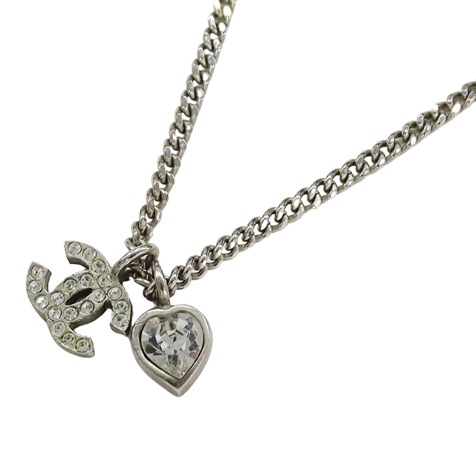 Chanel Necklace For Women Brand Name Metal Rhinestone Coco Mark Heart Silver 09C: Chanel Necklace For Women Brand Name Metal Rhinestone Coco Mark Heart Silver 09C This silver Chanel necklace features a beautiful metal and rhinestone design, adorned with the iconic Coco Mark Heart s