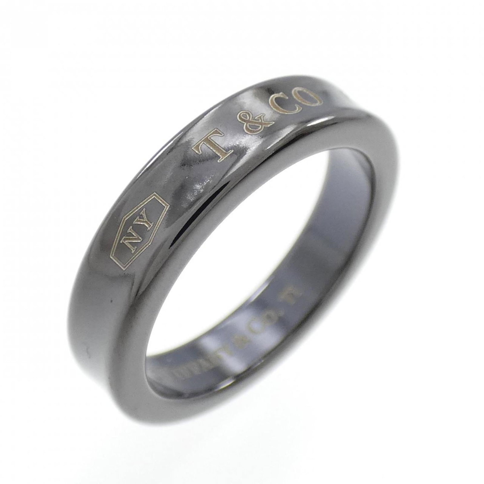 Tiffany Band Ring Titanium: Tiffany Band Ring Titanium Titanium band ring with sleek black and gray design, crafted from durable titanium material. This used item has hardly any traces of usage, making it a great option for