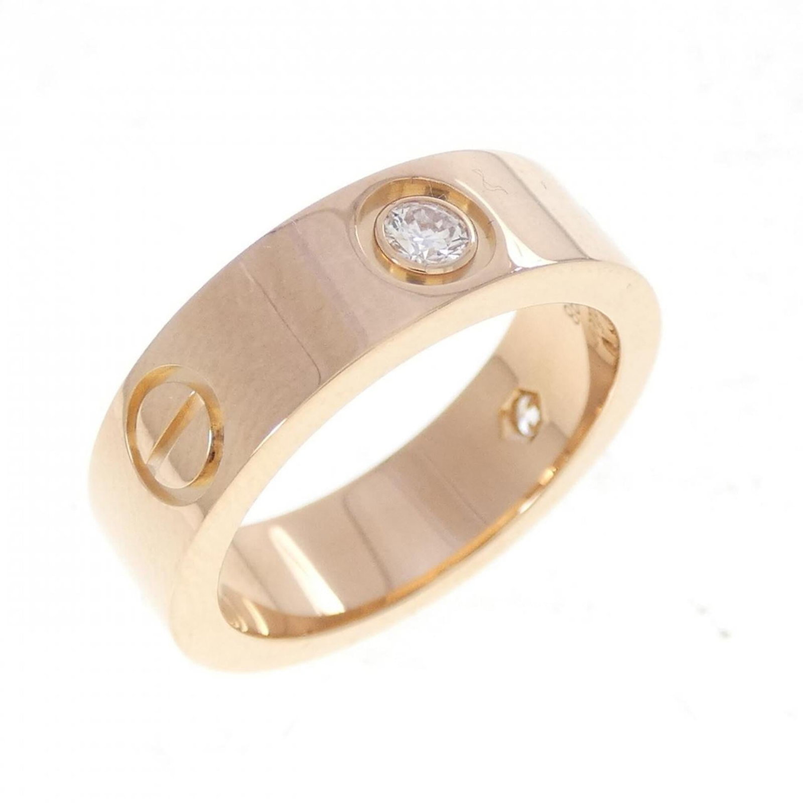Pink gold 18k ring band from Cartier: Pink gold 18k ring band from Cartier Pink gold 18k ring band from Cartier features a diamond stone and boasts a sleek, sophisticated design. Made from high-quality pink gold (18K), this band exudes