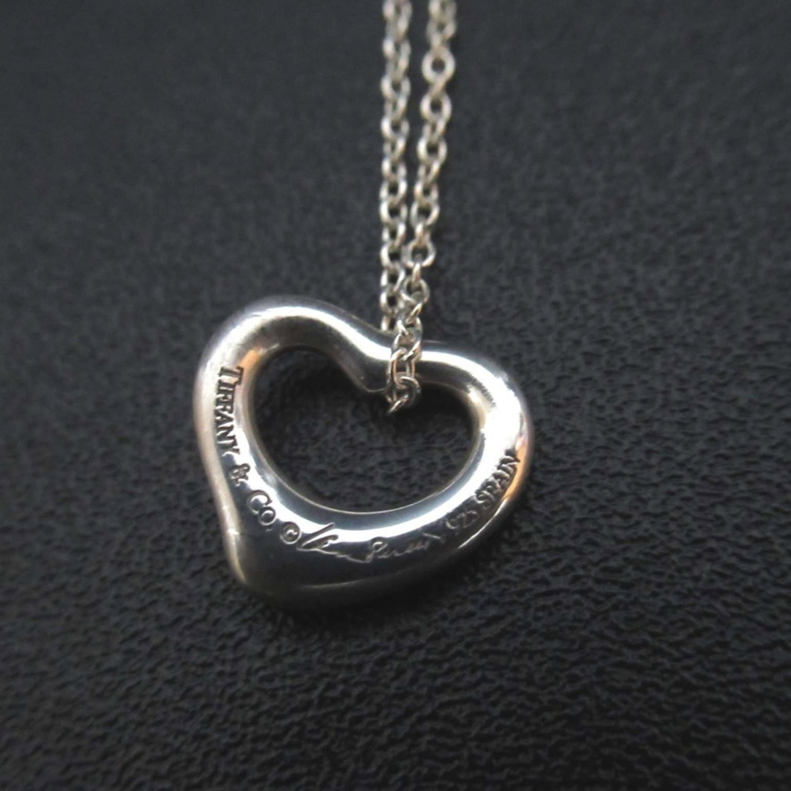 Tiffany Co Elsa Peretti Open Heart Mini Necklace Pendant In Sv Silver Women: Tiffany Co Elsa Peretti Open Heart Mini Necklace Pendant In Sv Silver Women Silver 925 Elsa Peretti Open Heart Mini Necklace Pendant from Tiffany & Co., featuring a delicate 10mm x 11mm open heart