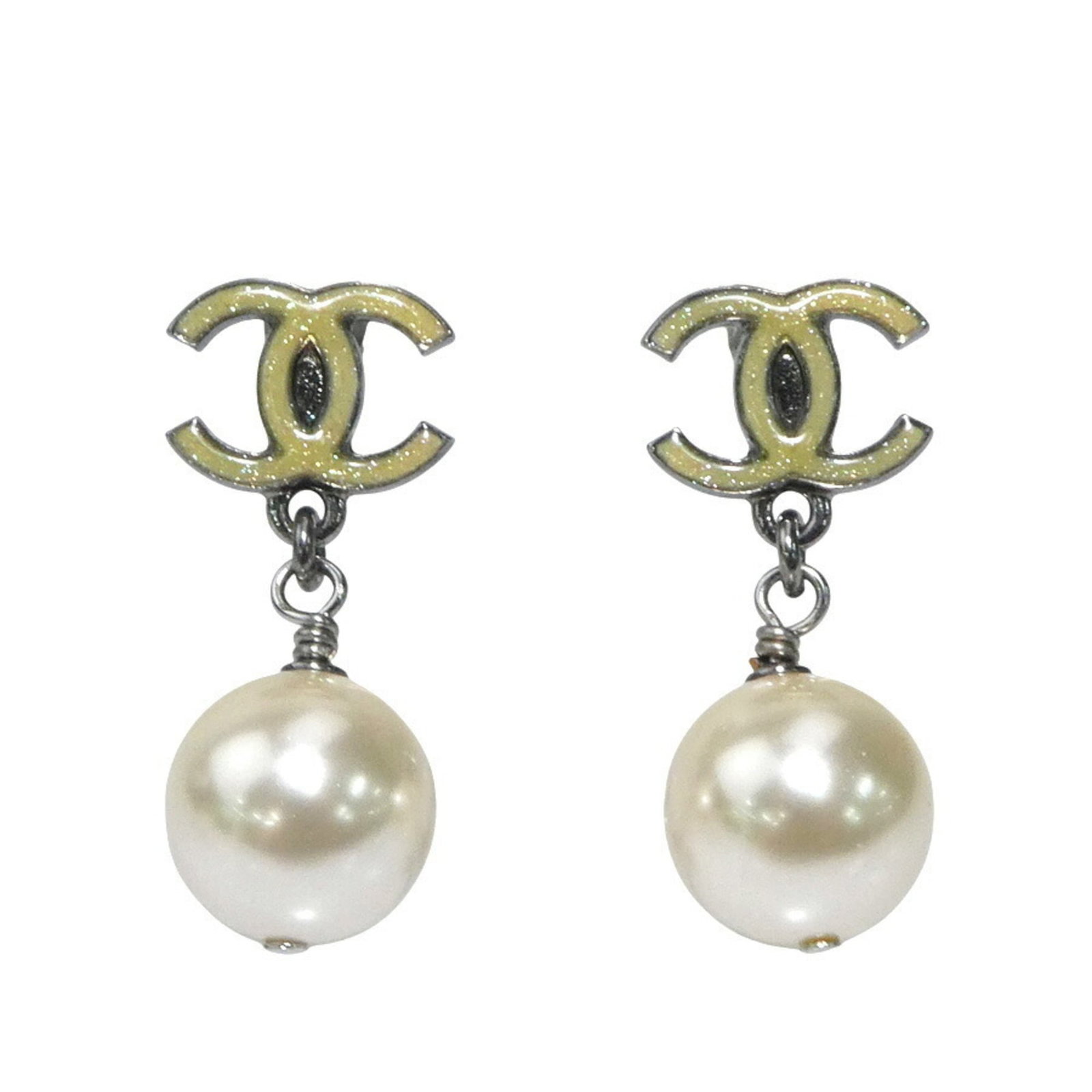 Stud Earrings Metal by Chanel: Stud Earrings Metal by Chanel Stud earrings by Chanel in off-white and silver metal, with a subtle size of 30.00mm x 12.00mm, offer a sleek and understated touch to any outfit. The earrings have