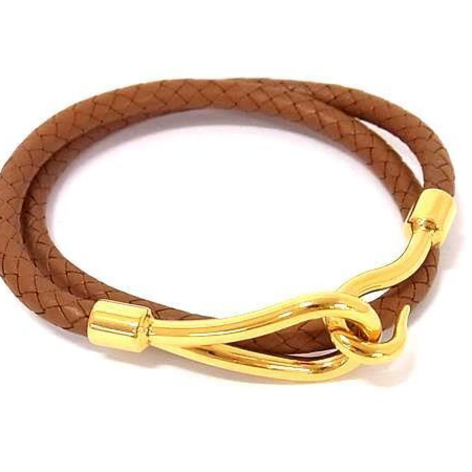 Metal Leather Charm Hermes Bracelet: Metal Leather Charm Hermes Bracelet A pre-owned Hermes leather and metal charm bracelet in brown and gold, with a length of 38cm. This used item features some scratches and dirt, but remains in very