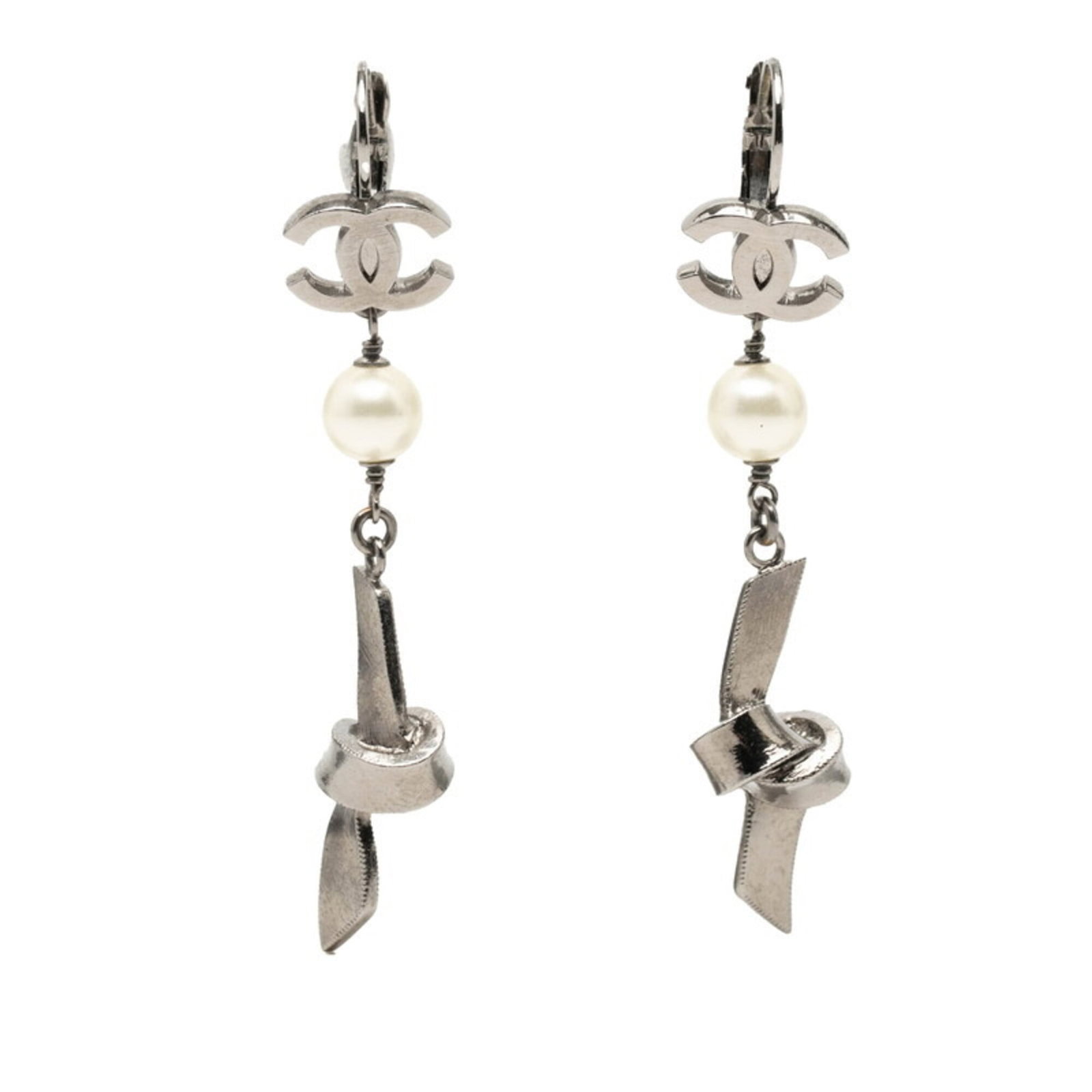 Stud Earrings Metal by Chanel: Stud Earrings Metal by Chanel Stud earrings by Chanel in silver metal, featuring a subtle pearl stone. The earrings are made from high-quality metal and have a classic stud design that suits everyday