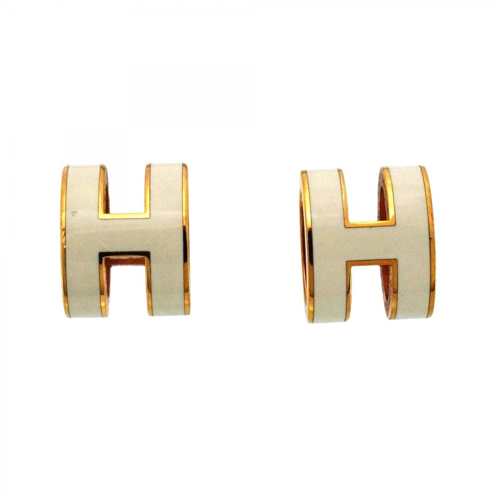 Hermes Stud earrings in gold plating: Hermes Stud earrings in gold plating Gold plating on these Hermes stud earrings adds a touch of luxury to any outfit. With their understated design and subtle shine, they are a versatile accessory for