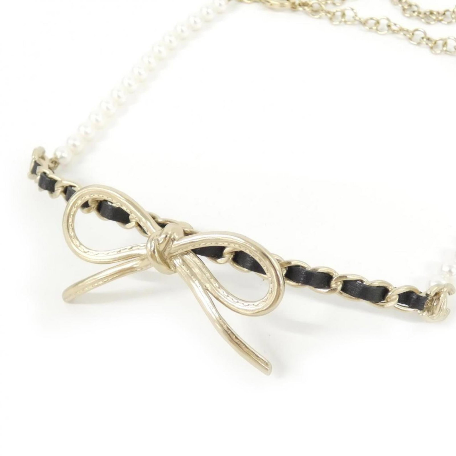 Chanel Necklace Ab8496: Chanel Necklace Ab8496 Chanel Necklace Ab8496 - A Timeless Classic. This iconic leather necklace features a 27mm x 55mm pendant in black and white, crafted from high-quality calfskin. With its sleek