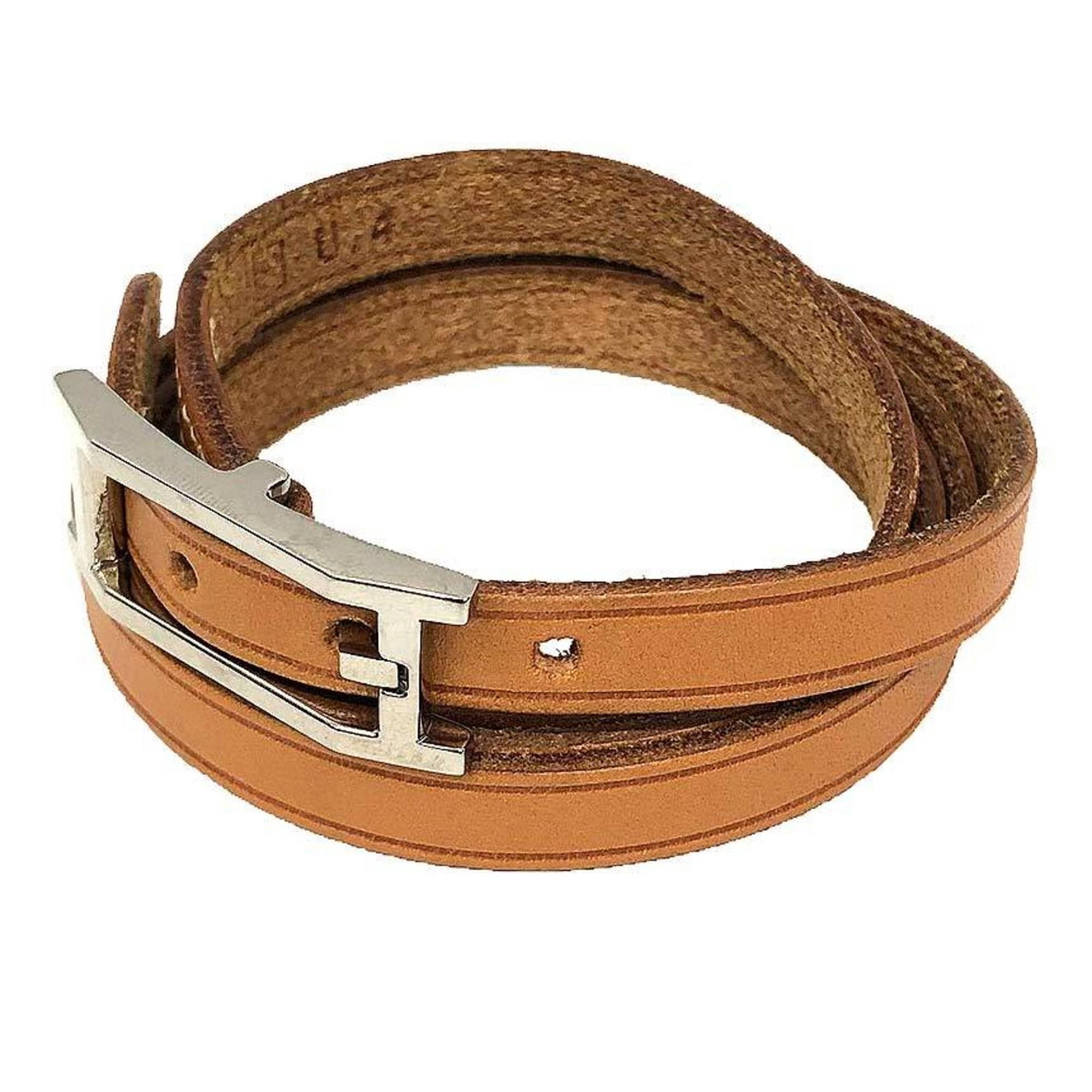 Hermes Charm Bracelet Leather: Hermes Charm Bracelet Leather This used Hermes Charm Bracelet Leather features a classic design with a camel-colored leather strap, measuring 66.5cm in length. The bracelet shows some signs of usage,