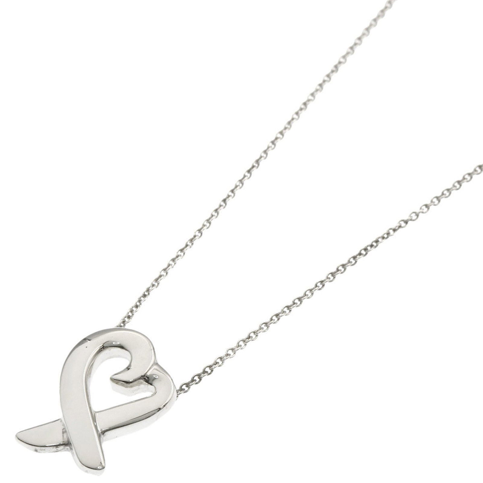 Women's loving silver heart necklace from Tiffany & Co.: Women's loving silver heart necklace from Tiffany & Co. Silver heart pendant from Tiffany & Co. features a delicate design with a subtle shine, suspended from a sterling silver chain. The necklace