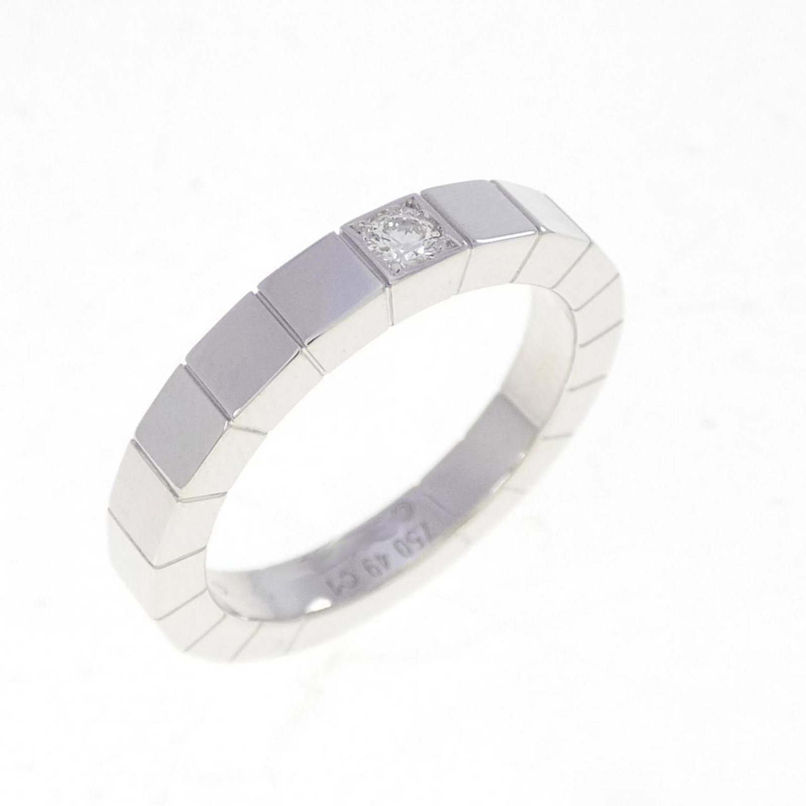 White Gold Cartier Band Ring 18K: White Gold Cartier Band Ring 18K White Gold Cartier Band Ring 18K features an 18k white gold construction, bearing the iconic Cartier brand. The ring's condition shows a few traces of usage, with
