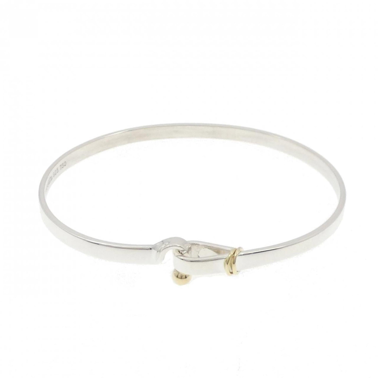 Tiffany Bangle Silver 925 Yellow Gold (18K): Tiffany Bangle Silver 925 Yellow Gold (18K) Silver 925, Yellow Gold (18K) construction gives this Tiffany bangle its distinctive look. The bangle measures 17cm in length and features a few traces of