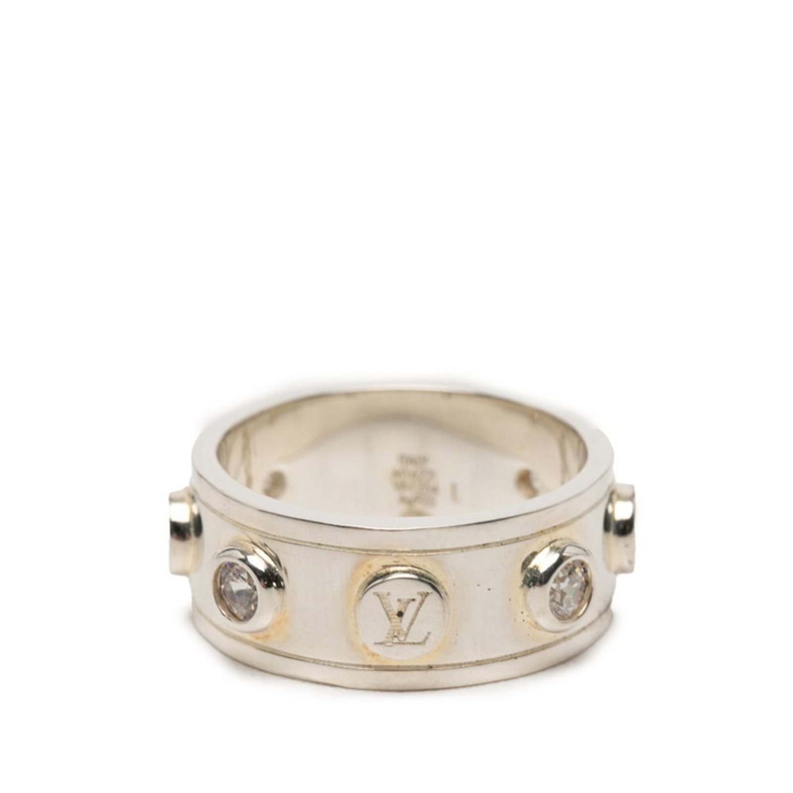 Silver band ring by Louis Vuitton: Silver band ring by Louis Vuitton Silver band ring by Louis Vuitton, featuring a distinctive zircon stone set against a silver 925 base. This men's band ring boasts a sleek design and measures 9.3mm i