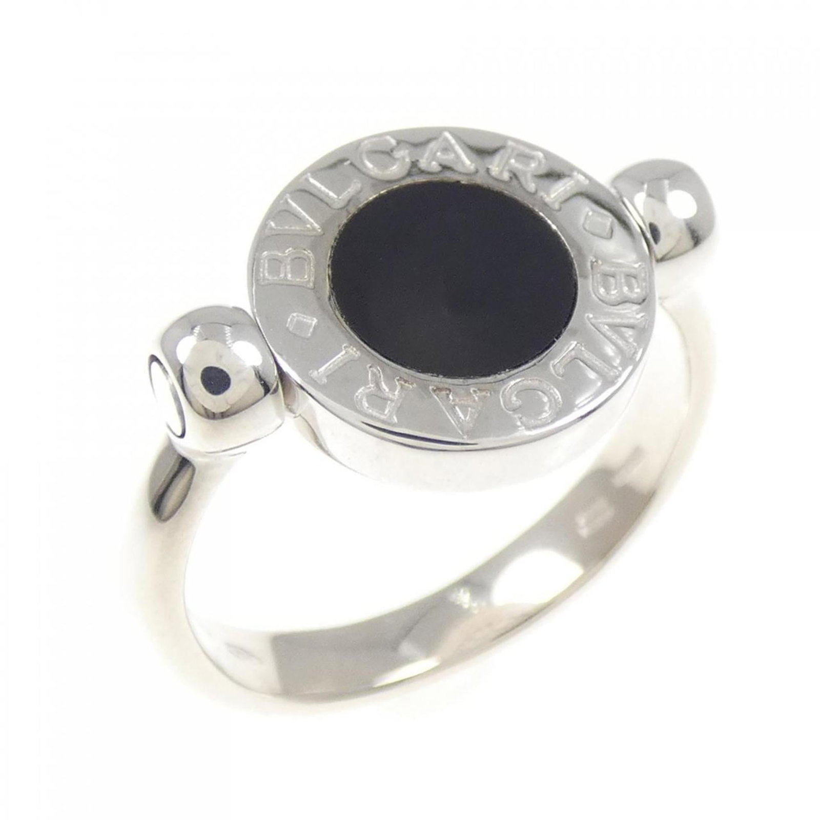 Bvlgari Ring: Bvlgari Ring White gold Bvlgari ring, featuring a sleek design with subtle details. This piece boasts a classic look and feel, with some minor signs of wear visible due to its used condition.