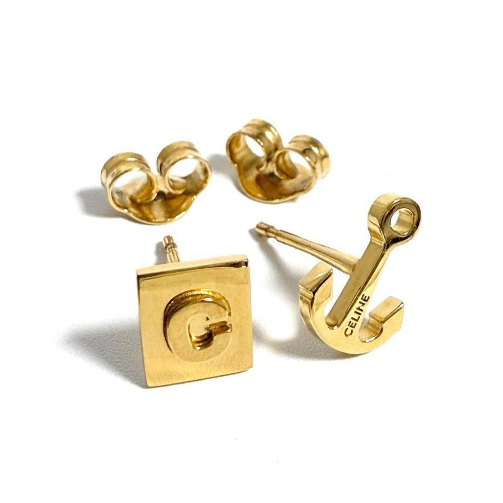 Celine Stud Metal Earrings: Celine Stud Metal Earrings Stud metal earrings from Celine, featuring a sleek and modern design. Made from high-quality metal, these earrings are in mint condition and show minimal signs of wear,