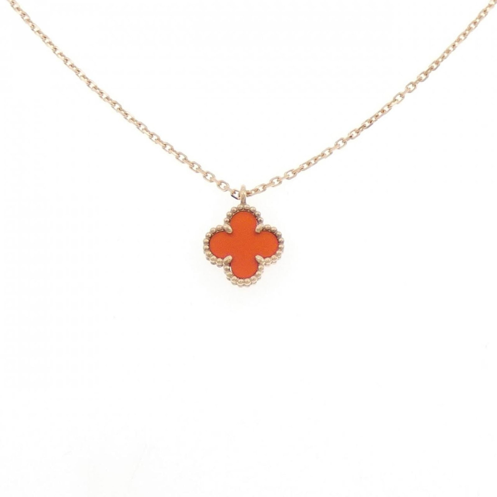 Alhambra Necklace by Van Cleef and Arpels: Alhambra Necklace by Van Cleef and Arpels Pink gold (18K) Alhambra Necklace by Van Cleef & Arpels features a pendant adorned with carnelian, showcasing the brand's signature craftsmanship. The