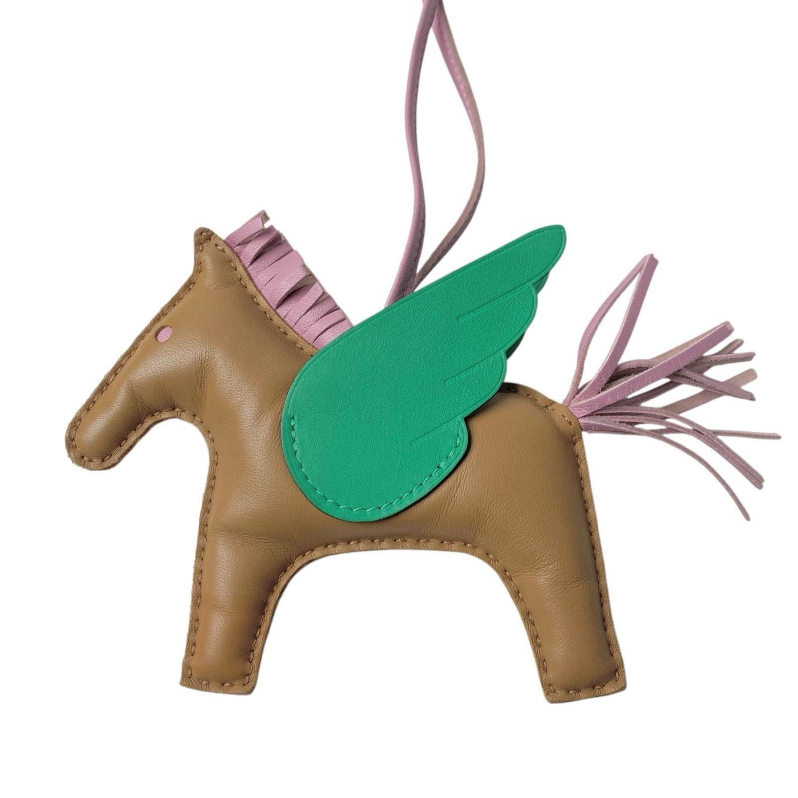 Hermes Handbag Charm Agneau Milo: Hermes Handbag Charm Agneau Milo Agneau Milo charm from Hermes, available in Beige, Green, Mint Green, and Pink hues. This small yet elegant accessory features a unique design that showcases the