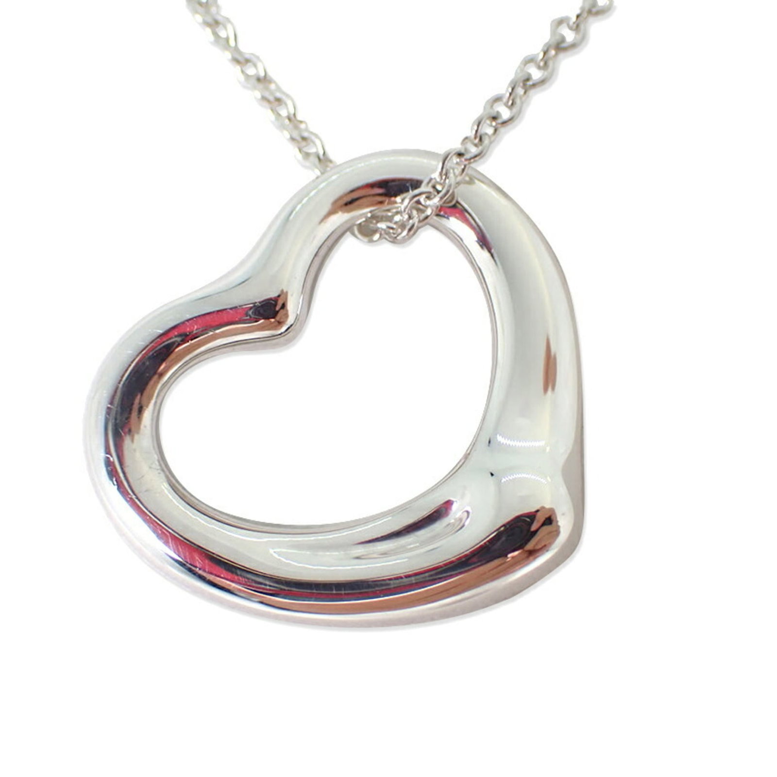 Tiffany 925 Heart Pendant Necklace: Tiffany 925 Heart Pendant Necklace Sterling silver pendant necklace from Tiffany, featuring a heart-shaped design. The necklace has a 41cm circumference and measures 19.7mm x 22.3mm in size. It bears