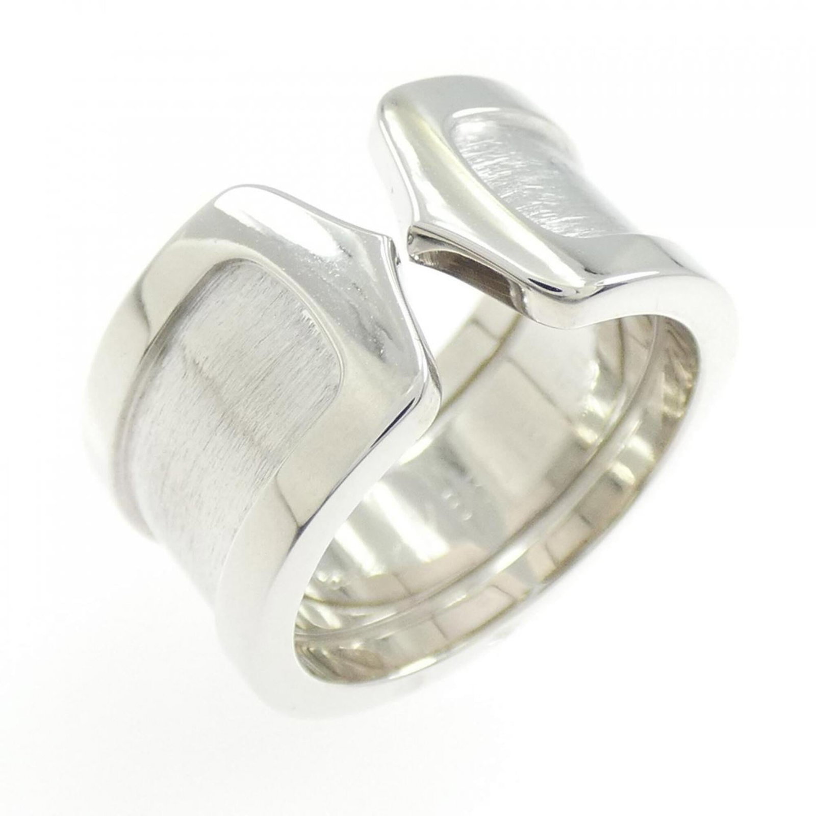 C2 Large Cartier Ring: C2 Large Cartier Ring This C2 Large Cartier Ring features 18K white gold construction and boasts a timeless design. The ring bears traces of usage, with some minor damages and dirt visible, but remain