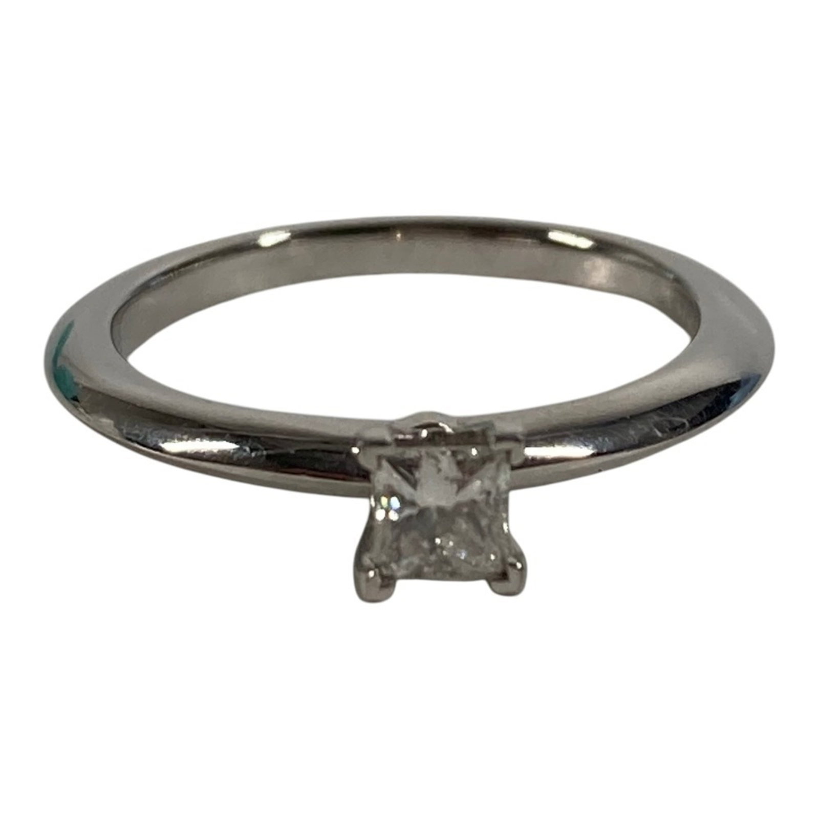Platinum ring by Tiffany band: Platinum ring by Tiffany band Platinum ring by Tiffany & Co. features a diamond stone weighing 0.19 carats, set in a platinum band with a US size 4 fit. This like-new condition piece shows hardly any 