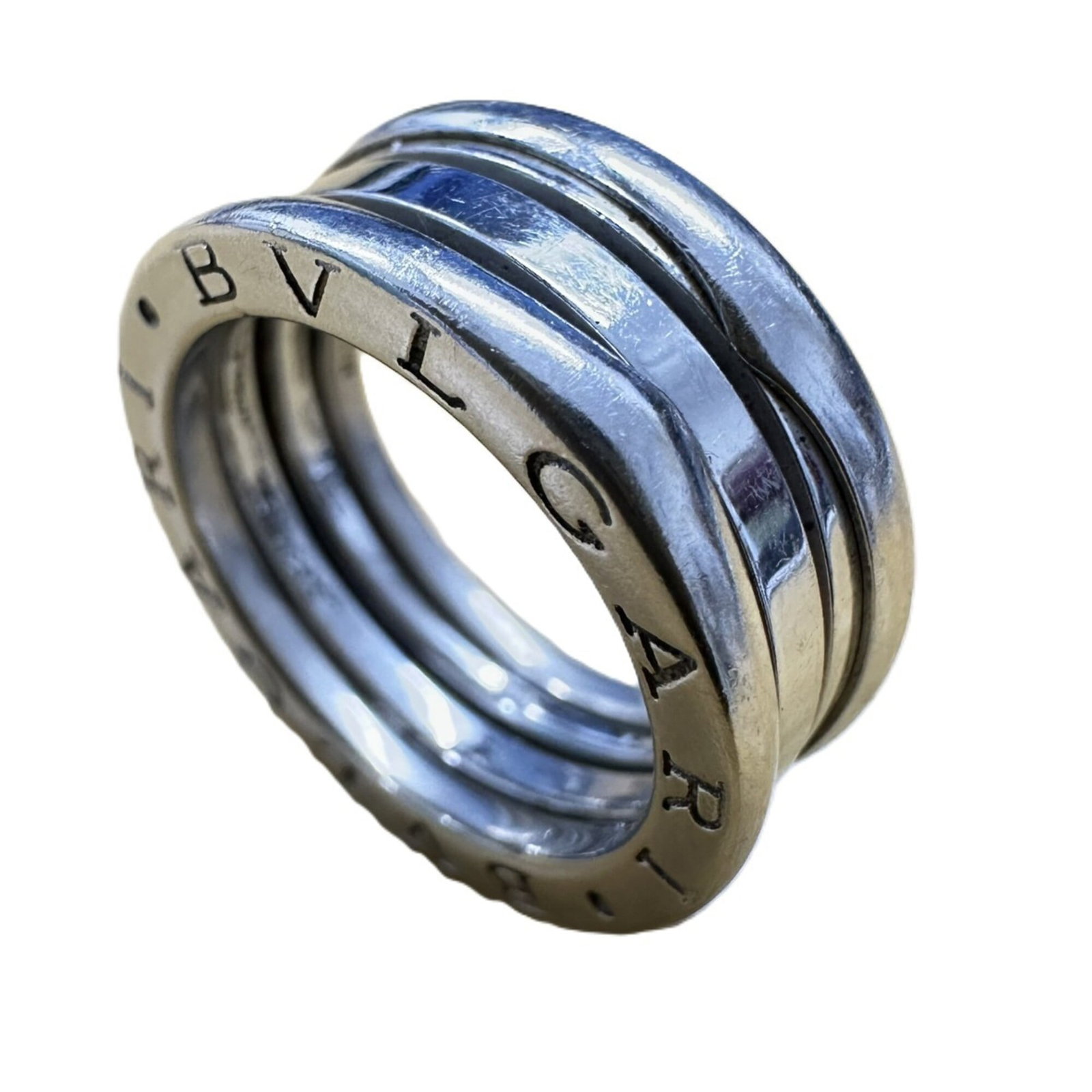 Bvlgari Band Ring White Gold (18K): Bvlgari Band Ring White Gold (18K) Bvlgari Band Ring White Gold (18K) - A sleek and sophisticated band ring in white gold, featuring the iconic Bvlgari brand. This 18k white gold piece boasts a
