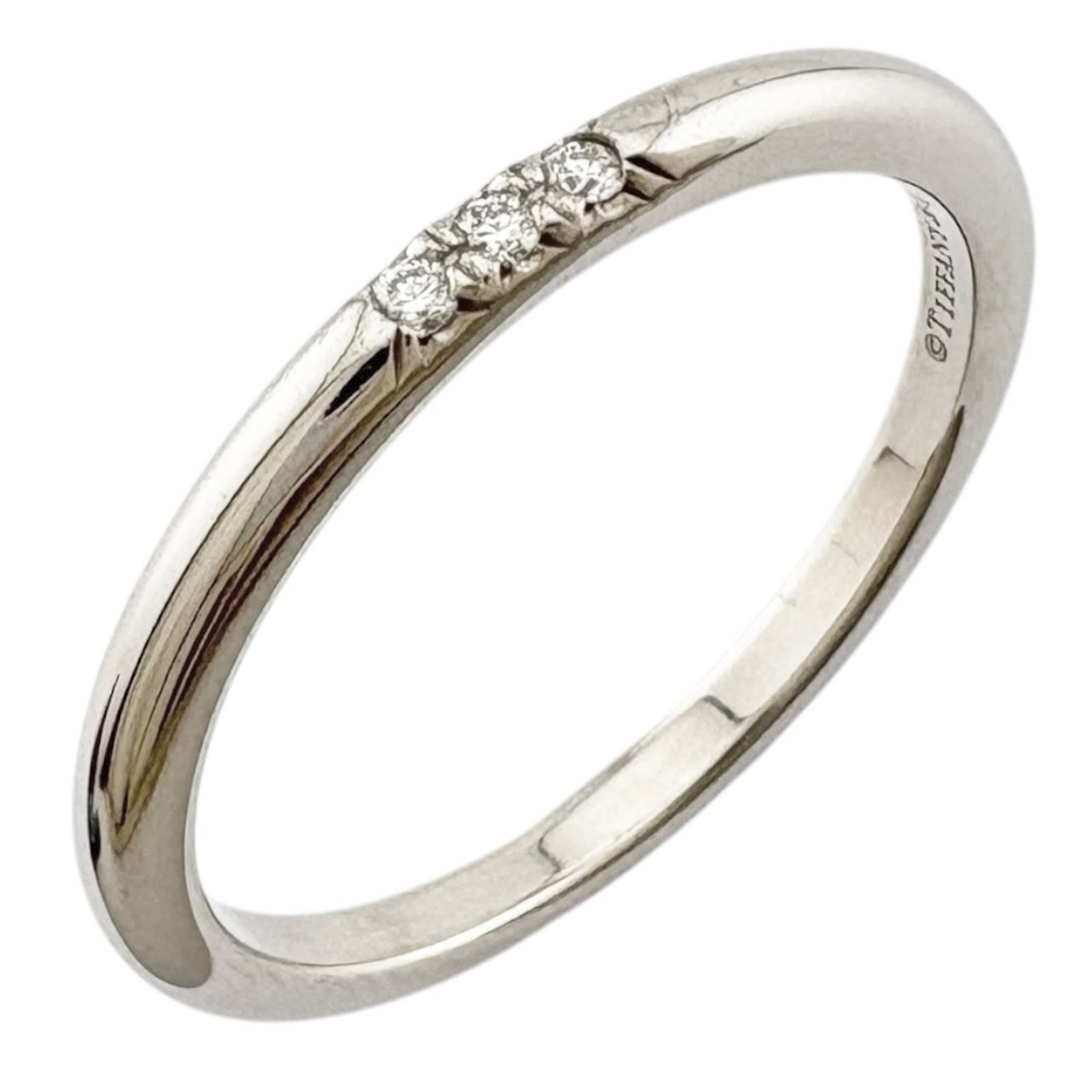 Platinum ring by Tiffany band: Platinum ring by Tiffany band Platinum ring by Tiffany features a diamond stone set in a high-quality band. The item has been refurbished to like new condition, with hardly any traces of usage. This