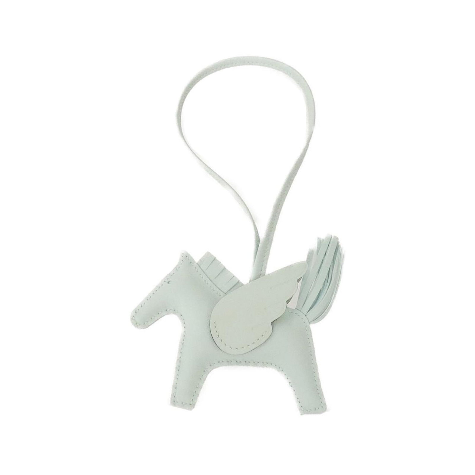 Hermes Handbag Charm Agneau Milo: Hermes Handbag Charm Agneau Milo Agneau Milo, the signature material from Hermes, gives this charm its unique texture and character. With a few traces of usage visible, this used charm still retains